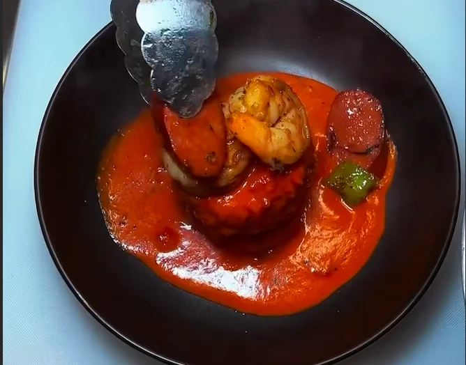 Cajun shrimp and sausage dish with rich tomato sauce