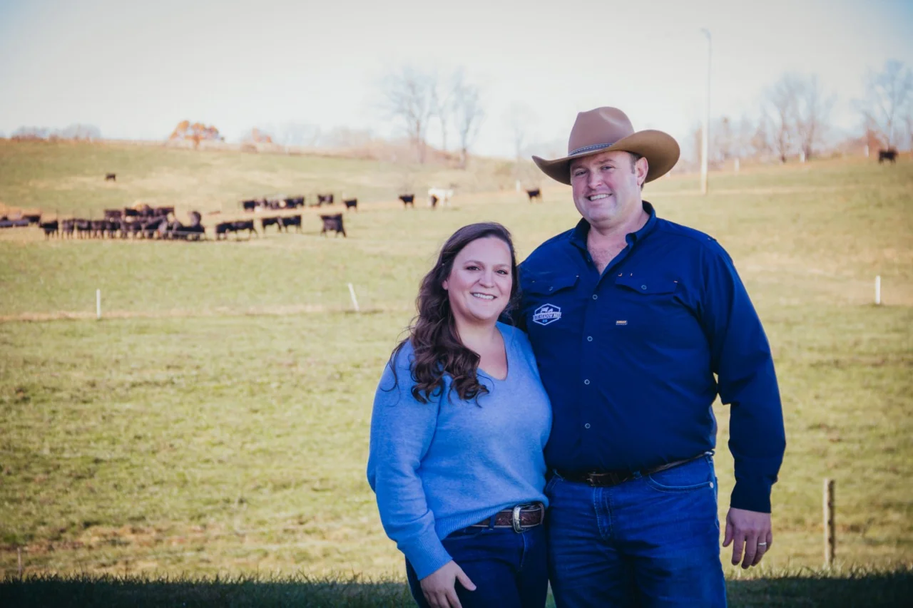 Couple enjoying a large meal featuring Blue Meadow Beef.