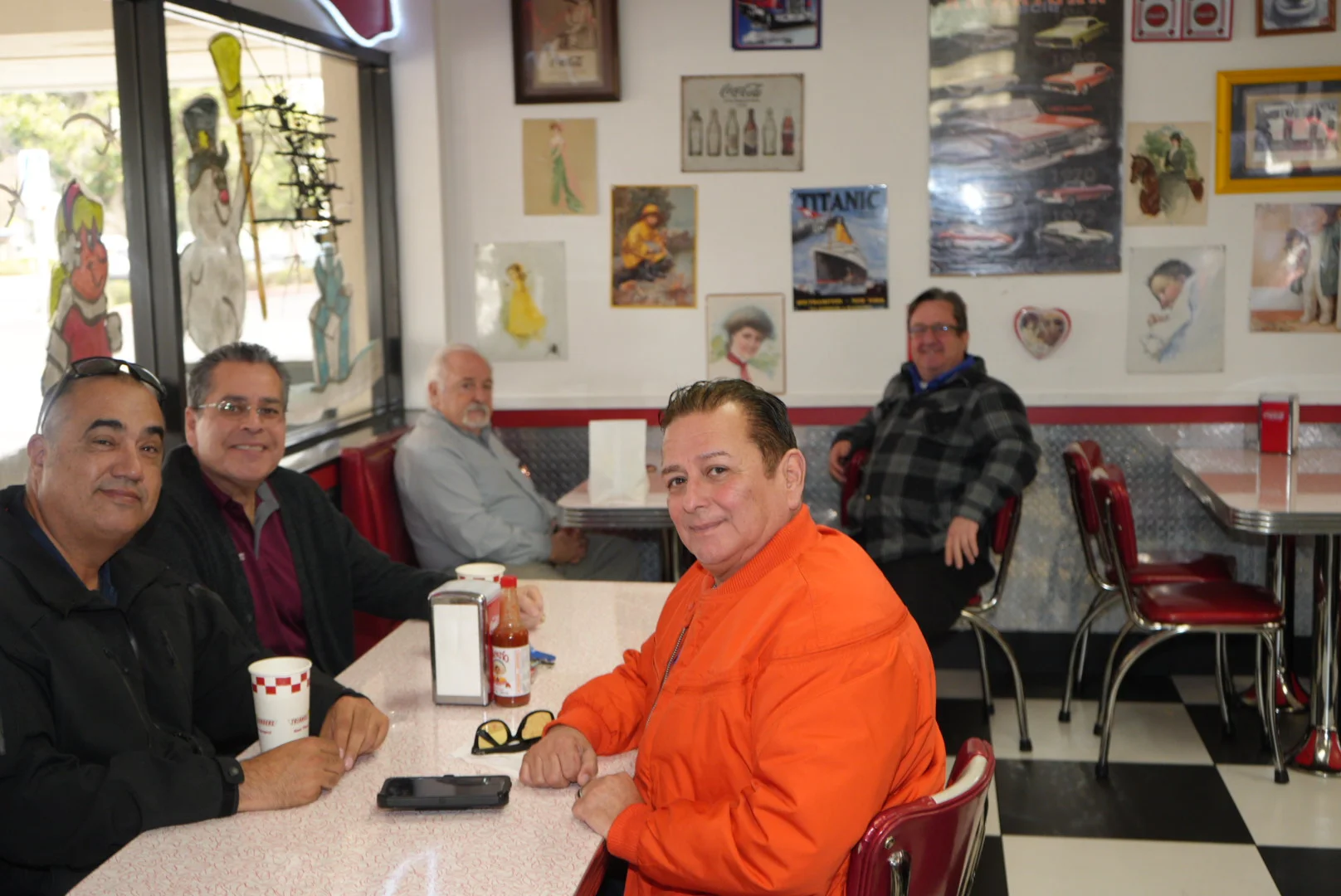 Cozy diner interior with patrons enjoying conversation