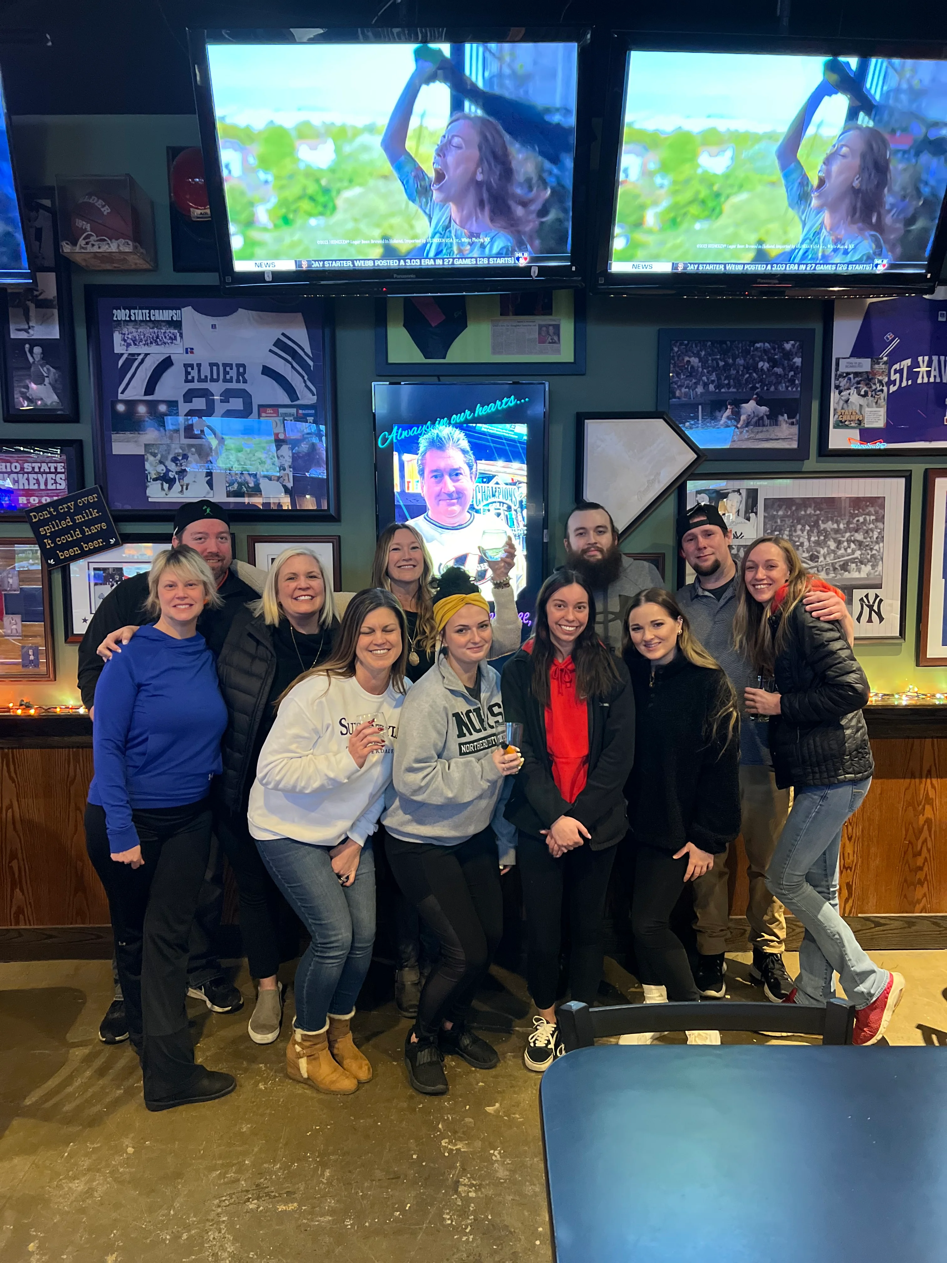Group of friends enjoying a lively night out at a bar