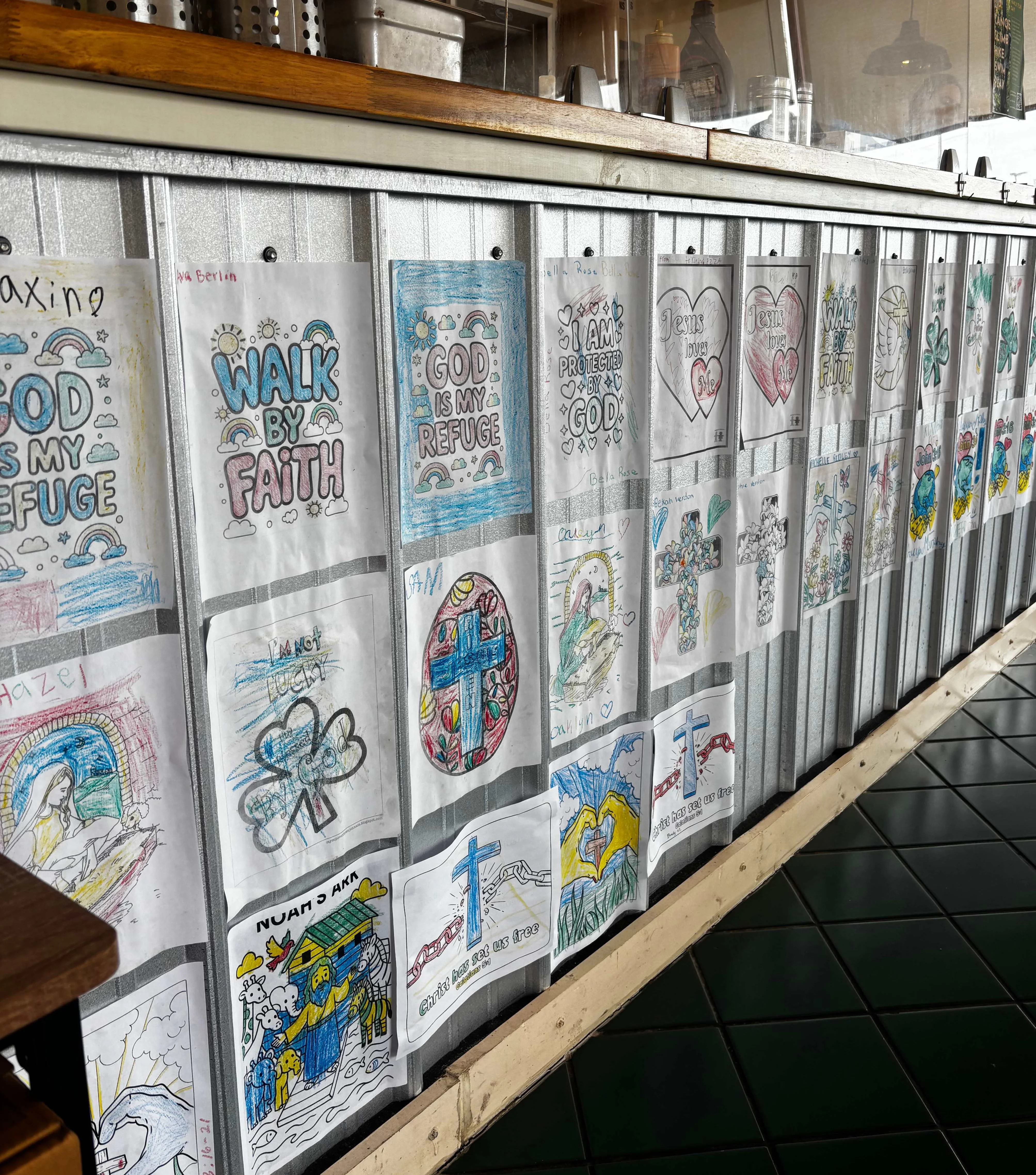 Colorful artwork displayed in a cozy restaurant interior