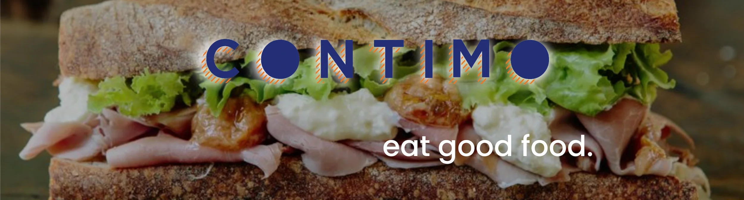 Gourmet sandwich with ham and greens on rustic bread