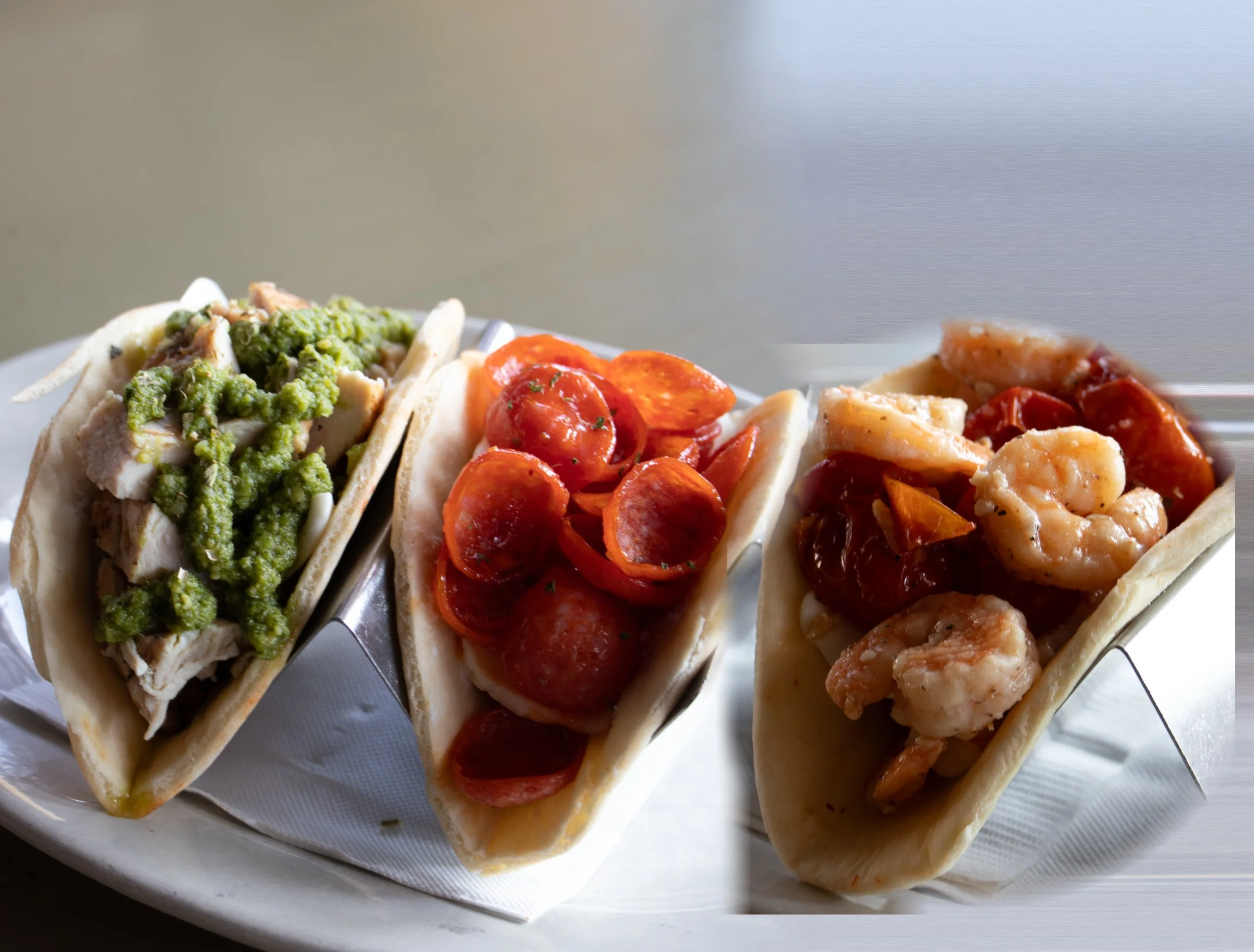 Italian Tacos at Naples Flatbread: pesto chicken, pepperoni and Amalfi shrimp folded in warm piadina