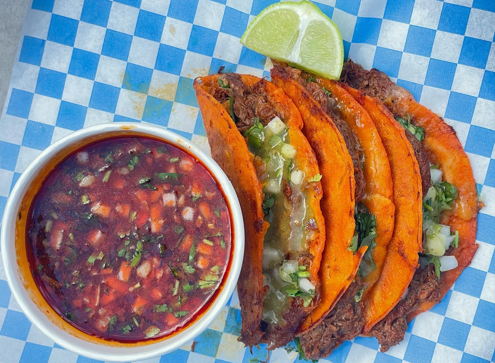 Delicious gourmet burger with fresh toppings on a wooden table