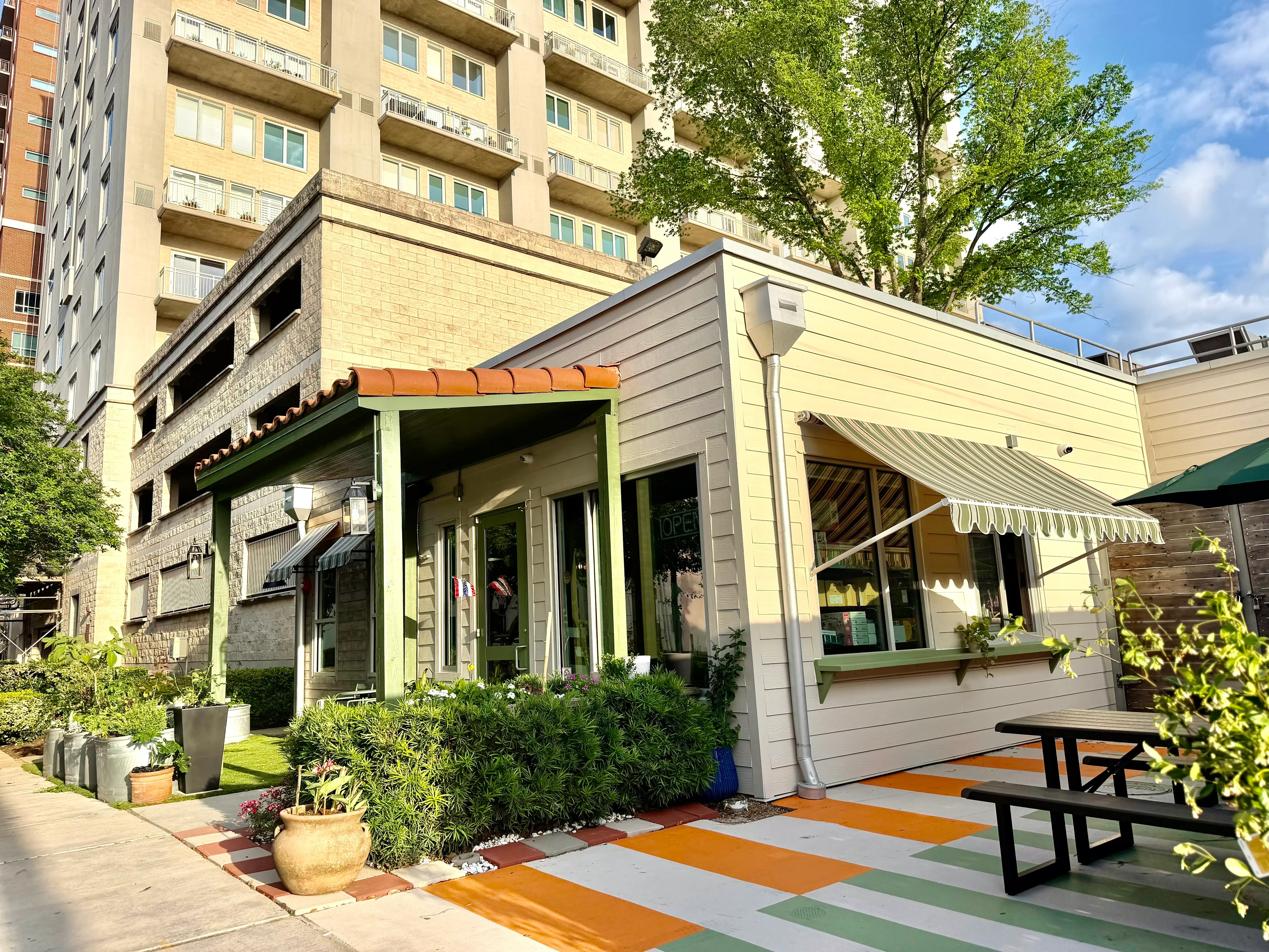 Exterior view of a modern restaurant with a welcoming entrance.