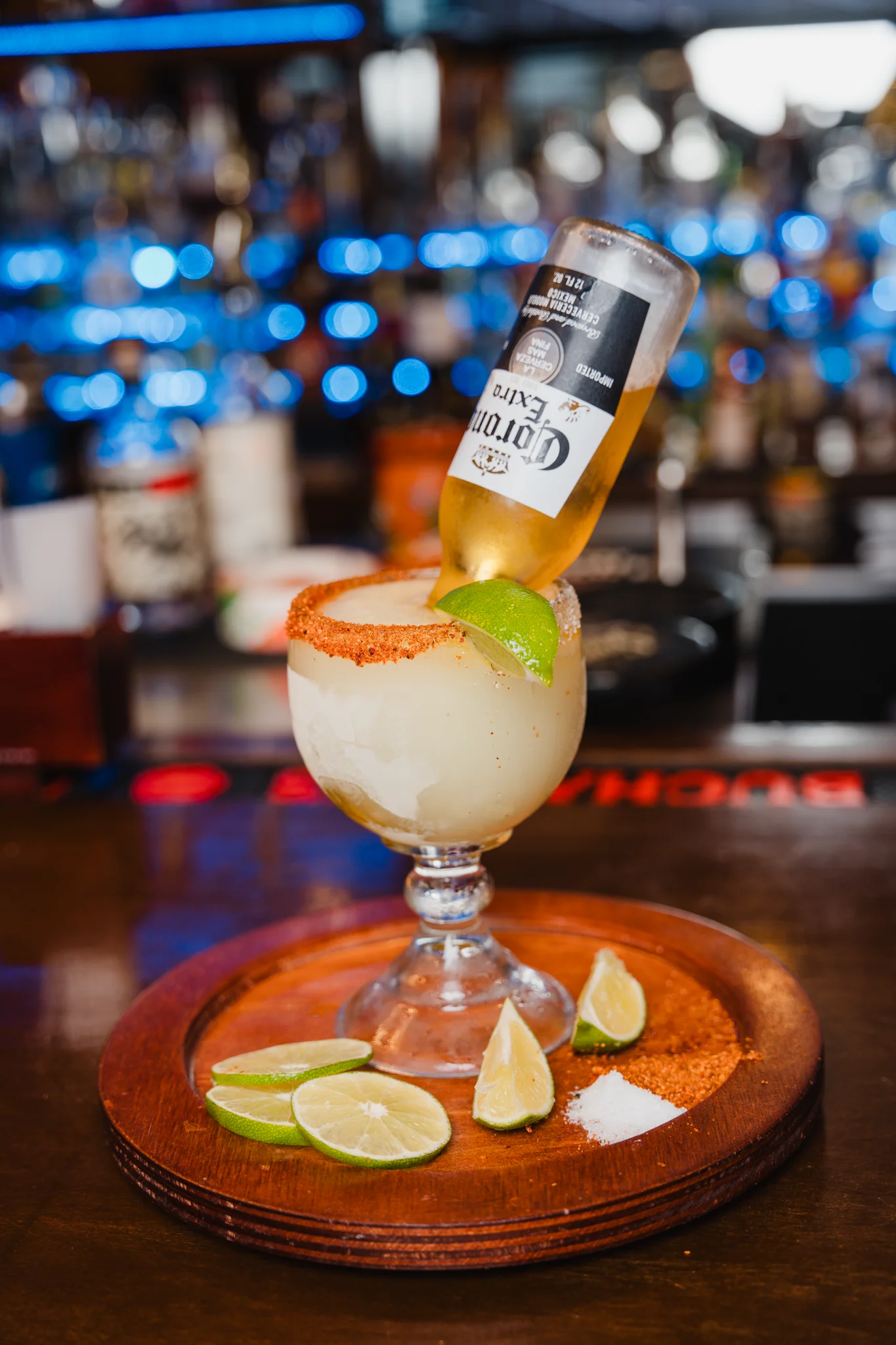 Refreshing margarita with a beer float and lime garnish