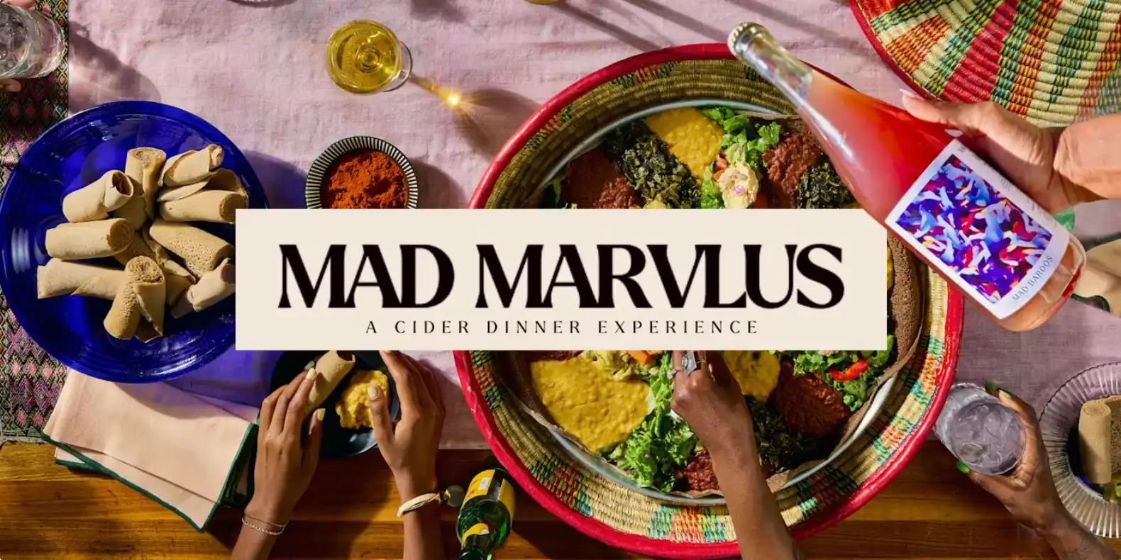 Mad Marvlus : a cider dinner experience, image shows a spread of Ethiopian food along with a Mad Marvlus cider