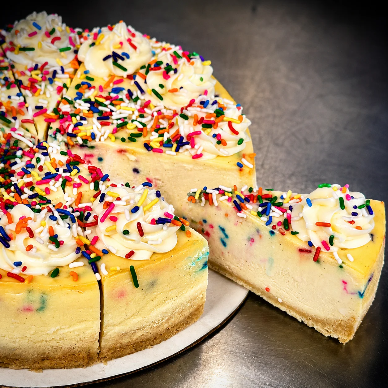 Colorful birthday cake cheesecake with sprinkles