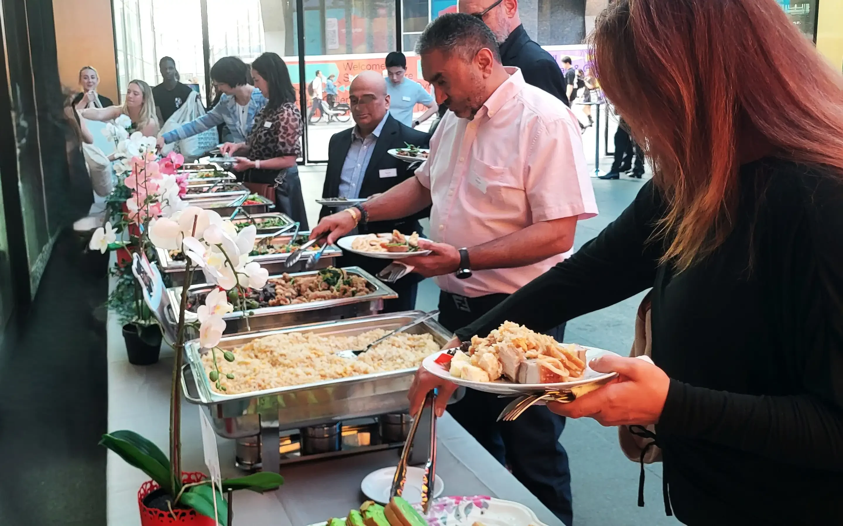Diverse buffet spread featuring various international dishes at a dining event