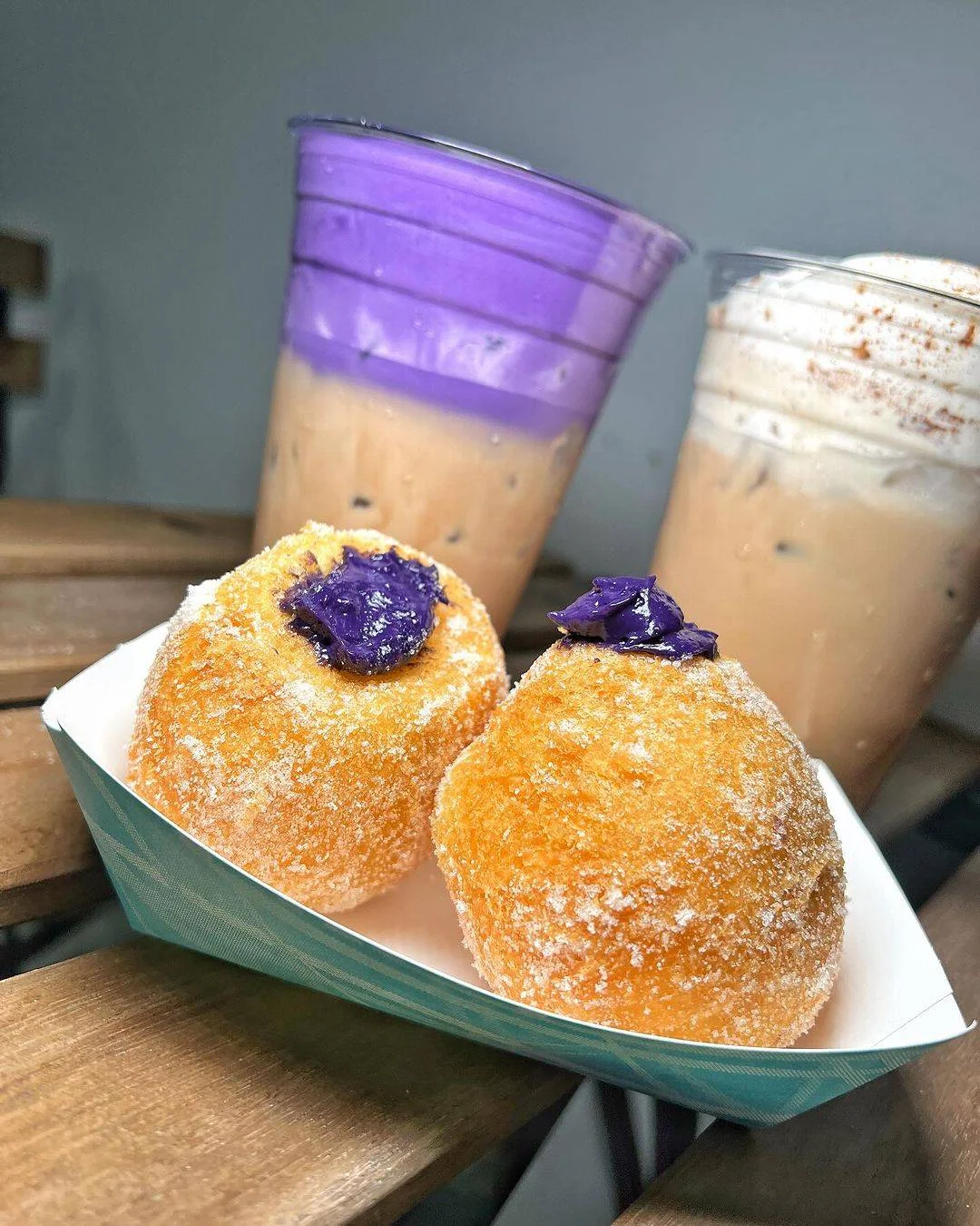 Filipino ube-filled doughnuts with iced coffee drinks