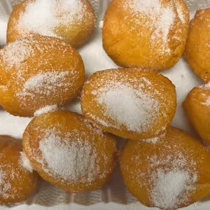 Delicious Indian gulab jamun dusted with sugar