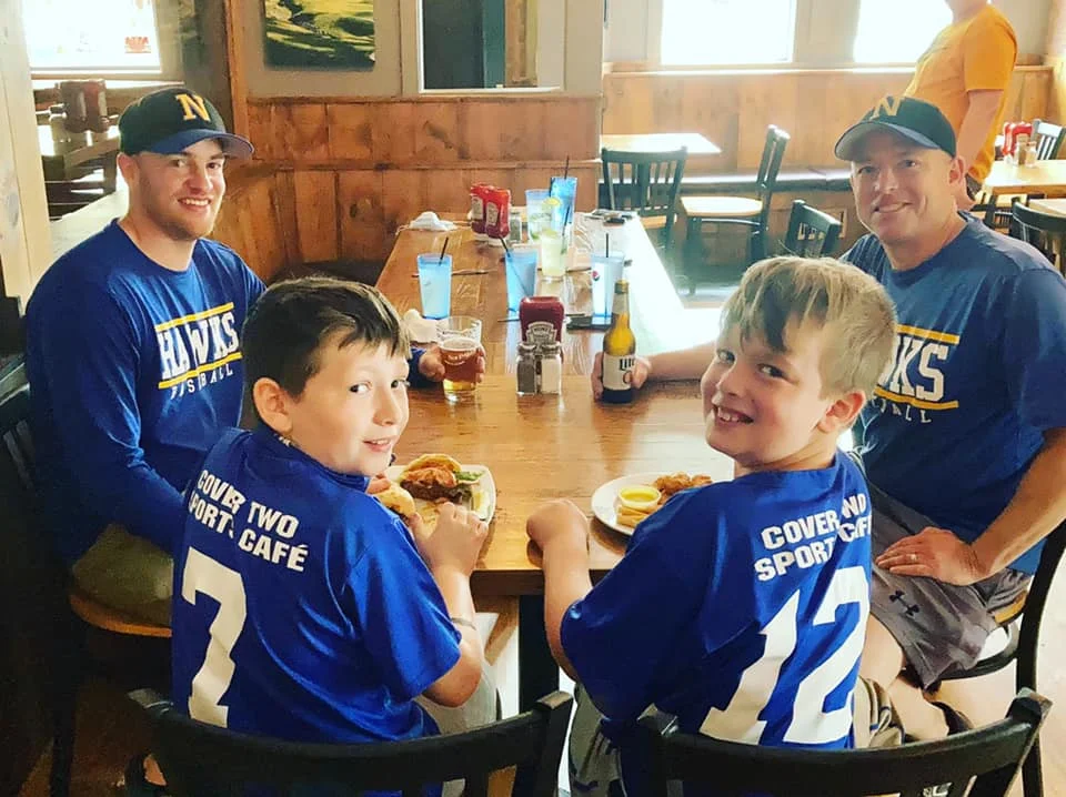 Family enjoying a meal at a cozy restaurant