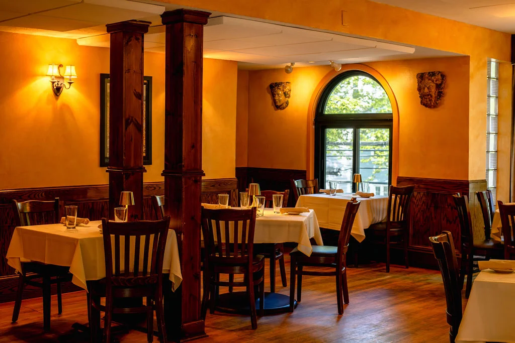Cozy restaurant interior with warm lighting and wooden accents
