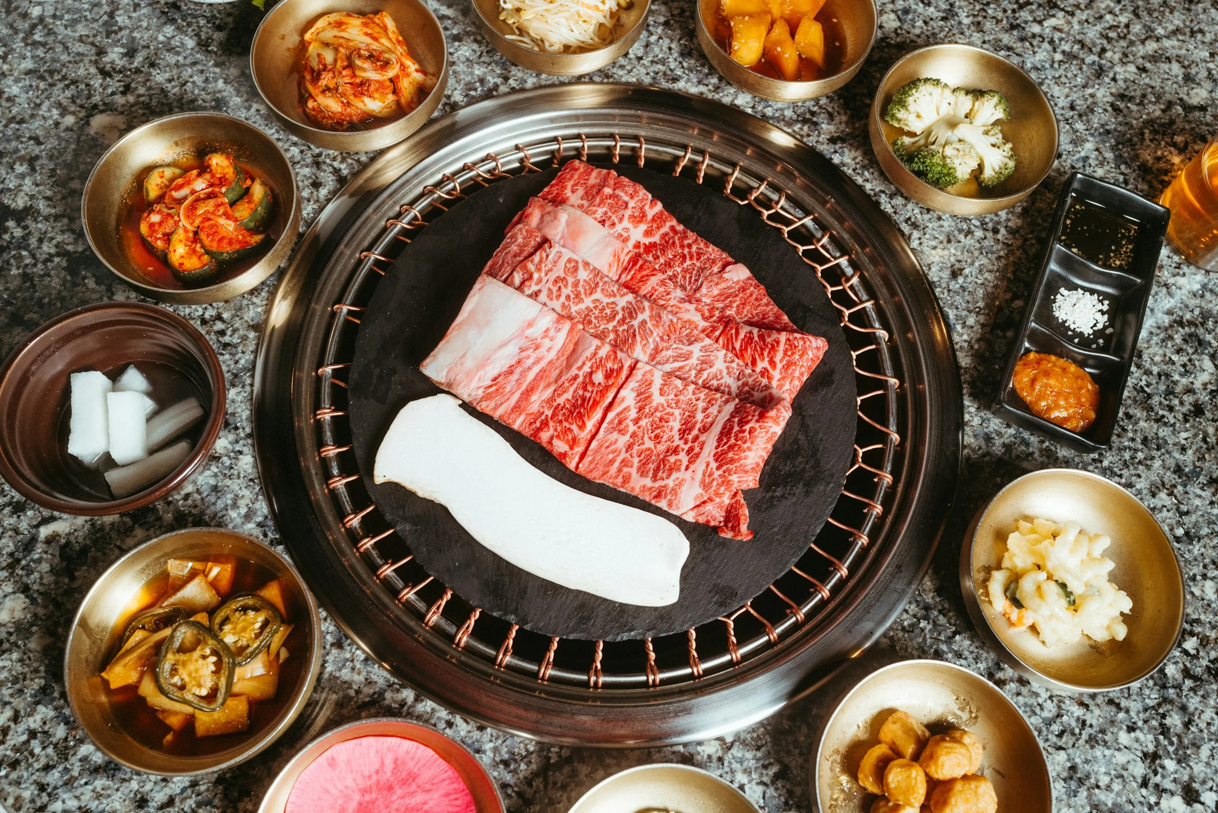Korean BBQ with marbled beef and assorted banchan