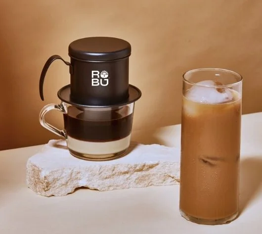 Vietnamese iced coffee with traditional phin brewer