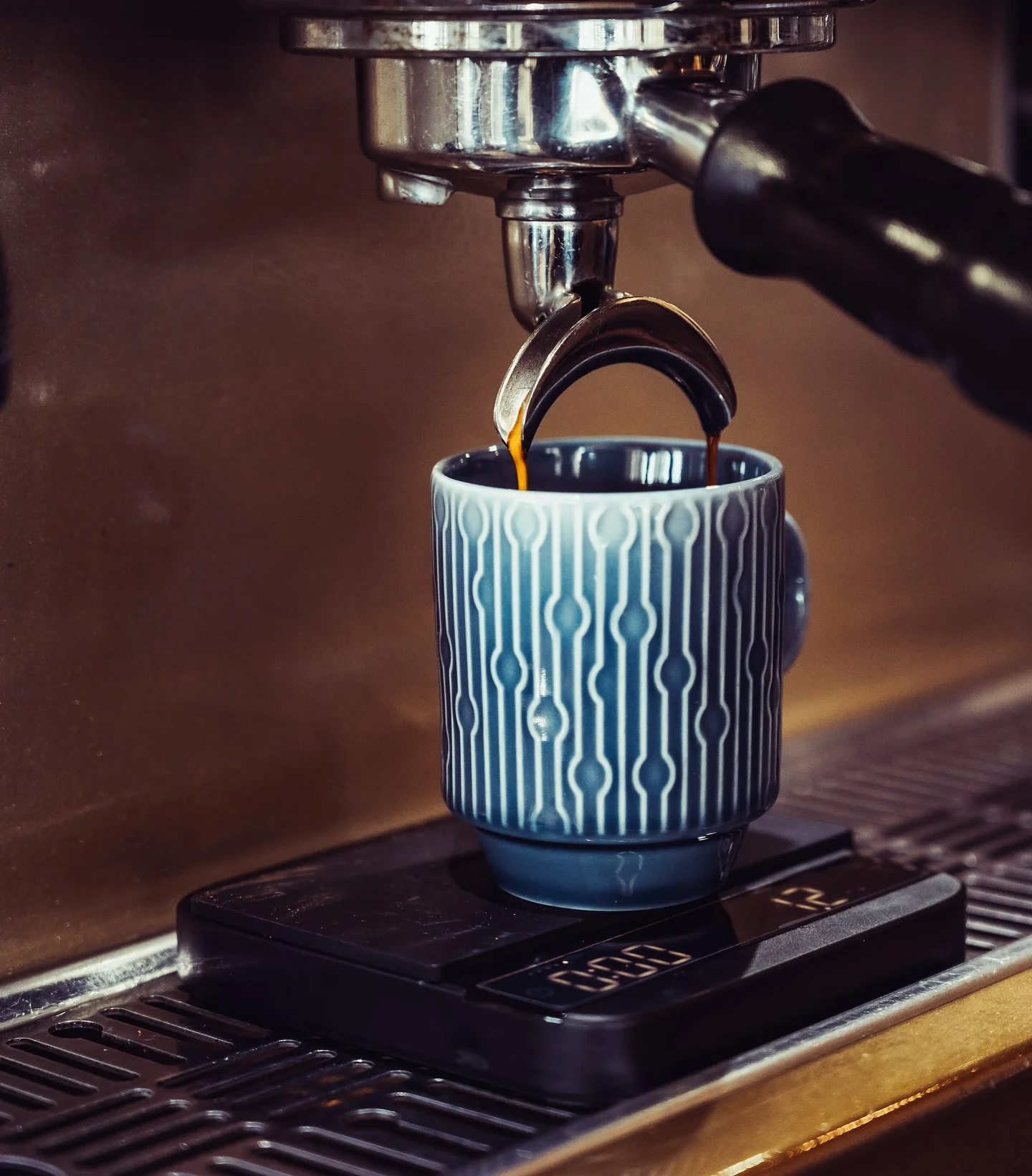 Espresso pouring into a blue cup at the Tripoli's coffee bar in Alamo Ranch, San Antonio