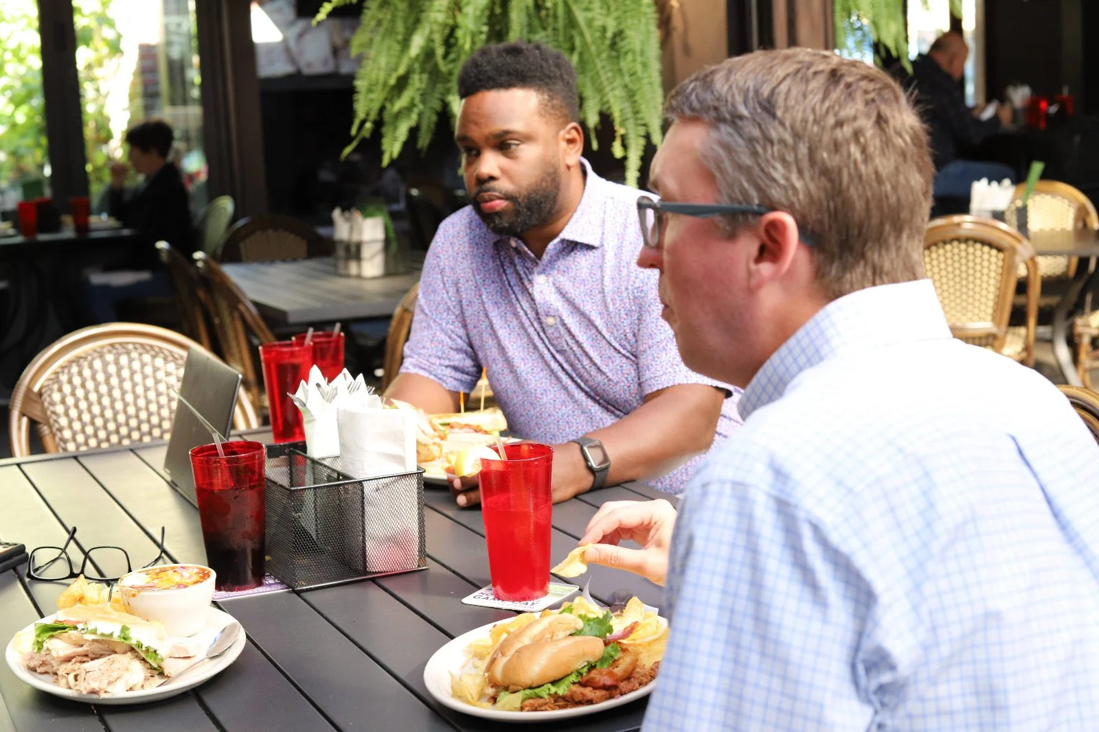Satisfied customers eating sandwiches 