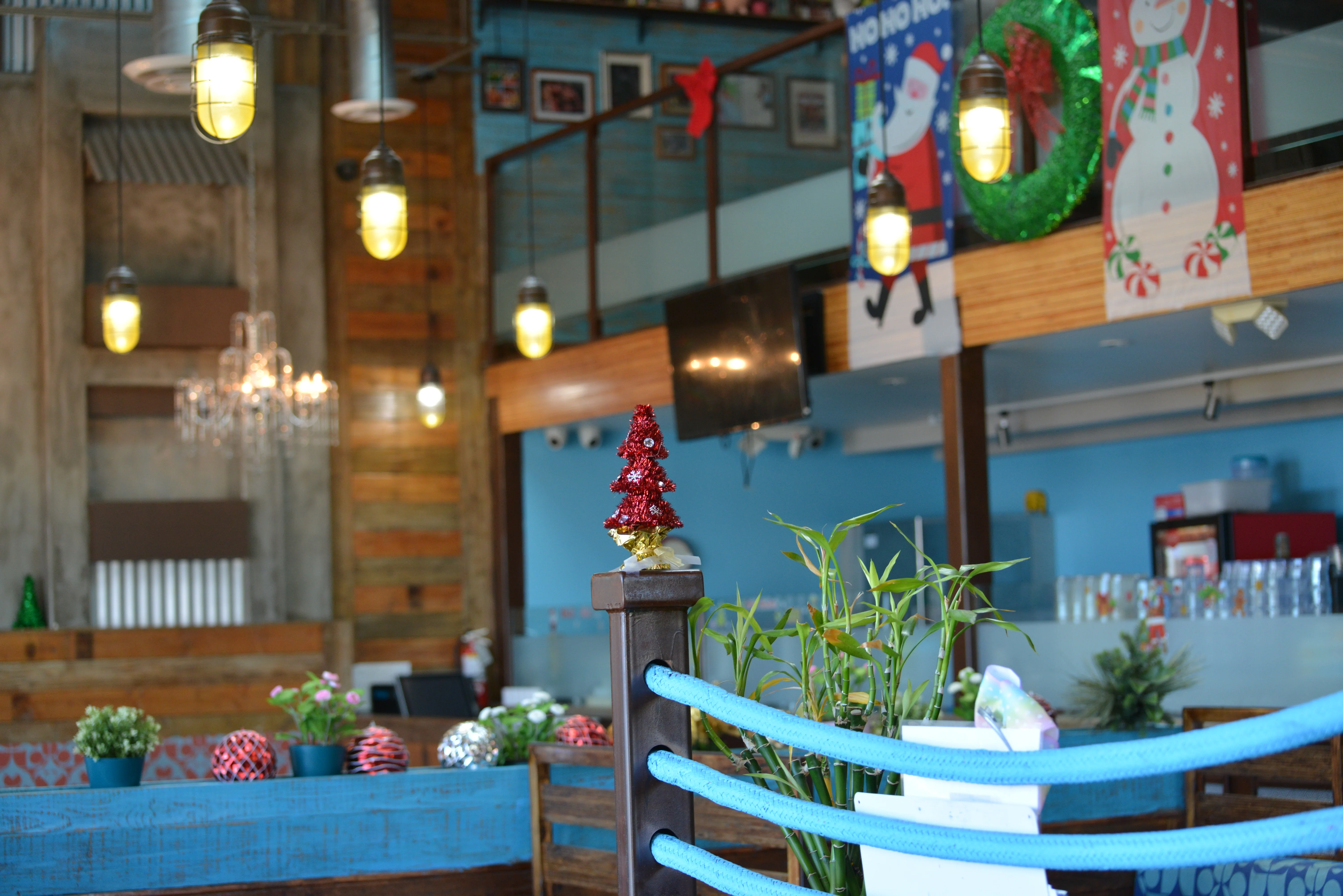 Festive restaurant interior with holiday decorations and cozy ambiance