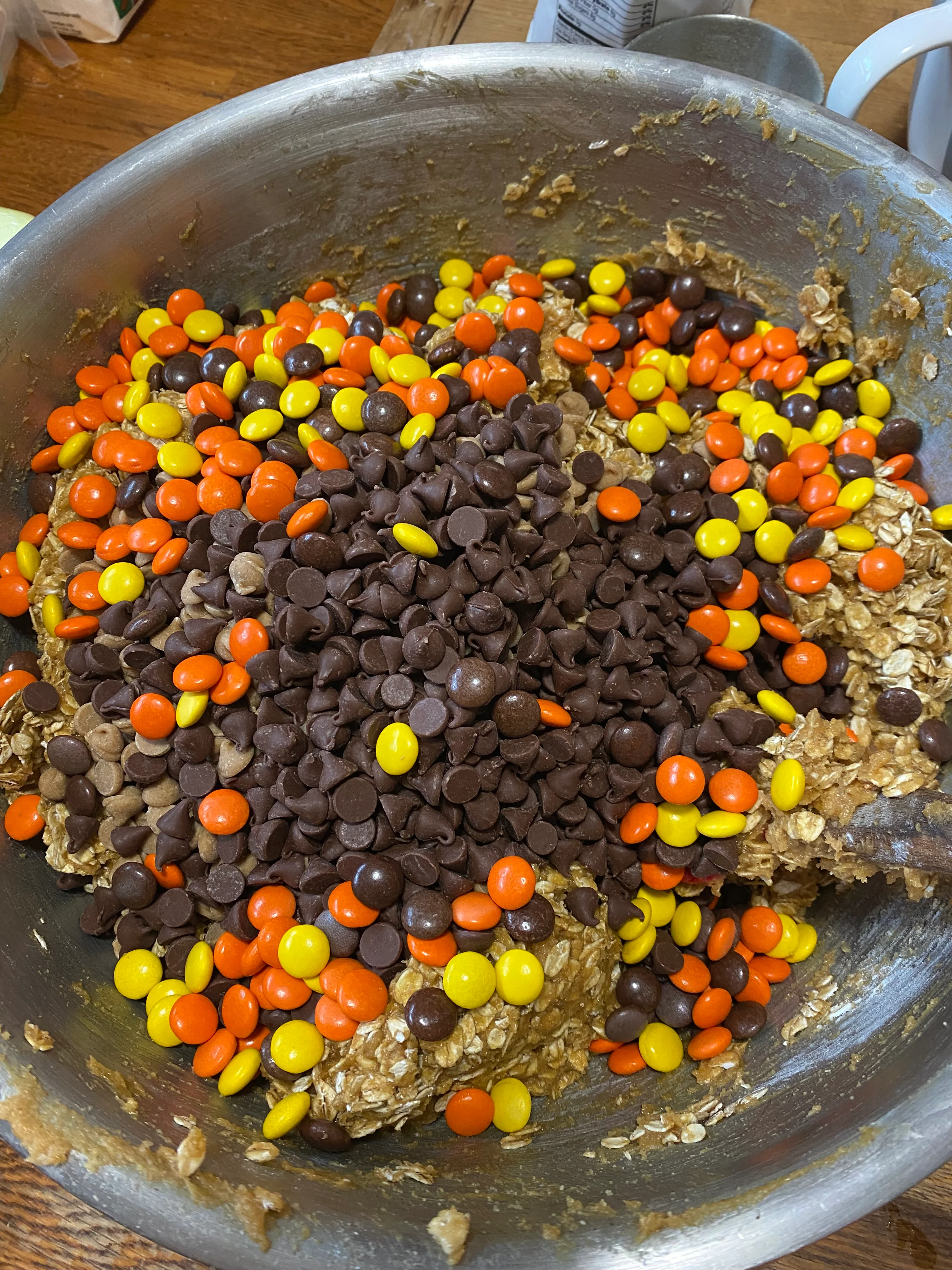 Bowl of cookie dough with chocolate and peanut butter candies