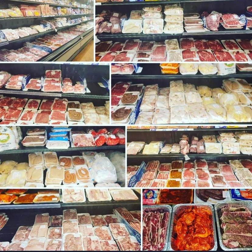 Variety of fresh meats displayed in a grocery store
