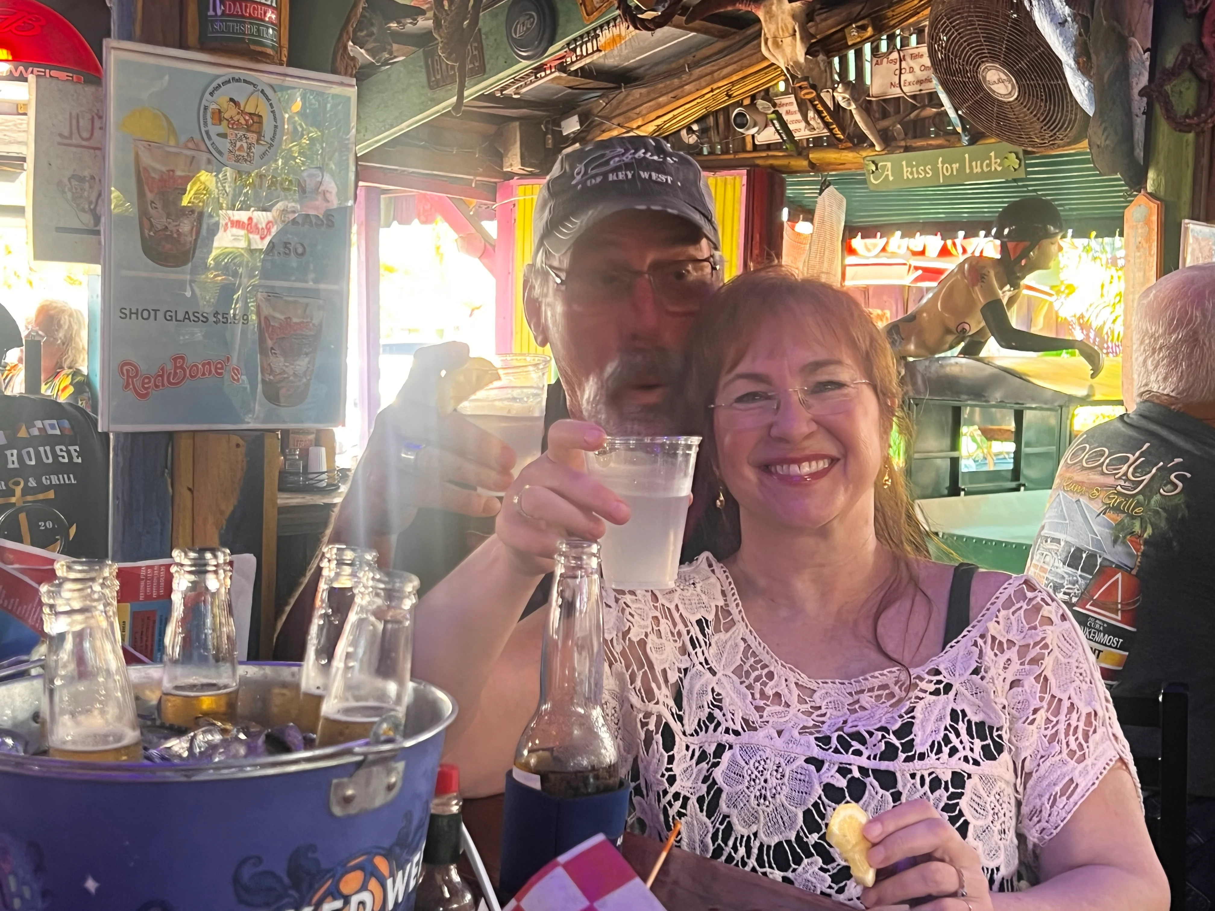 Cheers at a lively bar with drinks and smiles