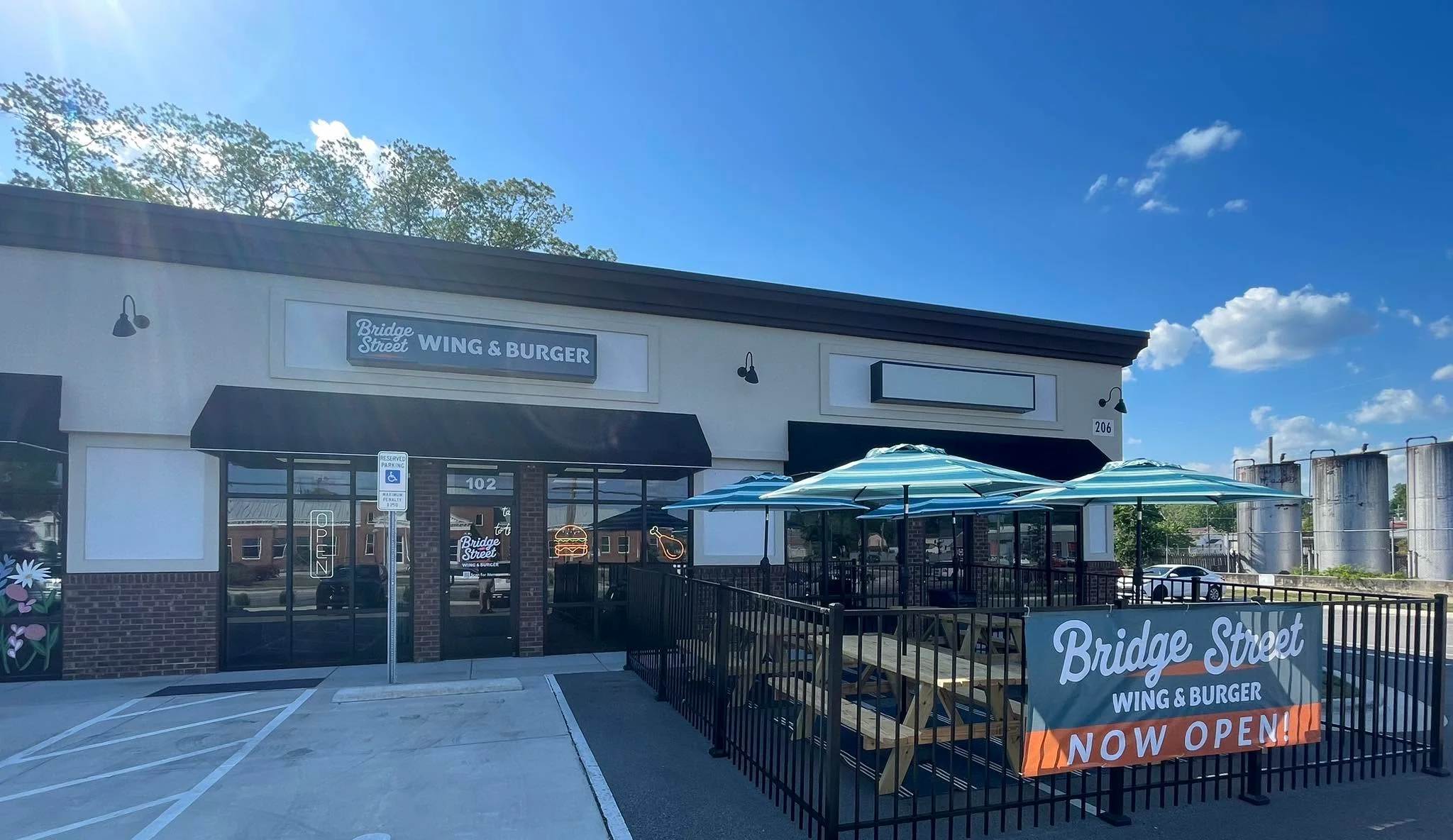 Exterior of Bridge Street Wing & Burger restaurant with outdoor seating