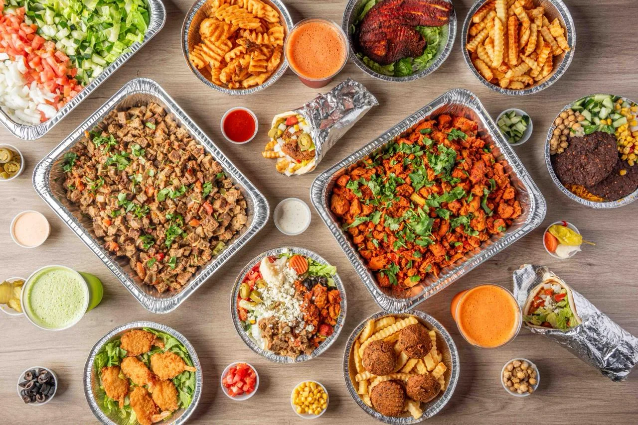 Mediterranean chicken platter with fresh salads and sauces
