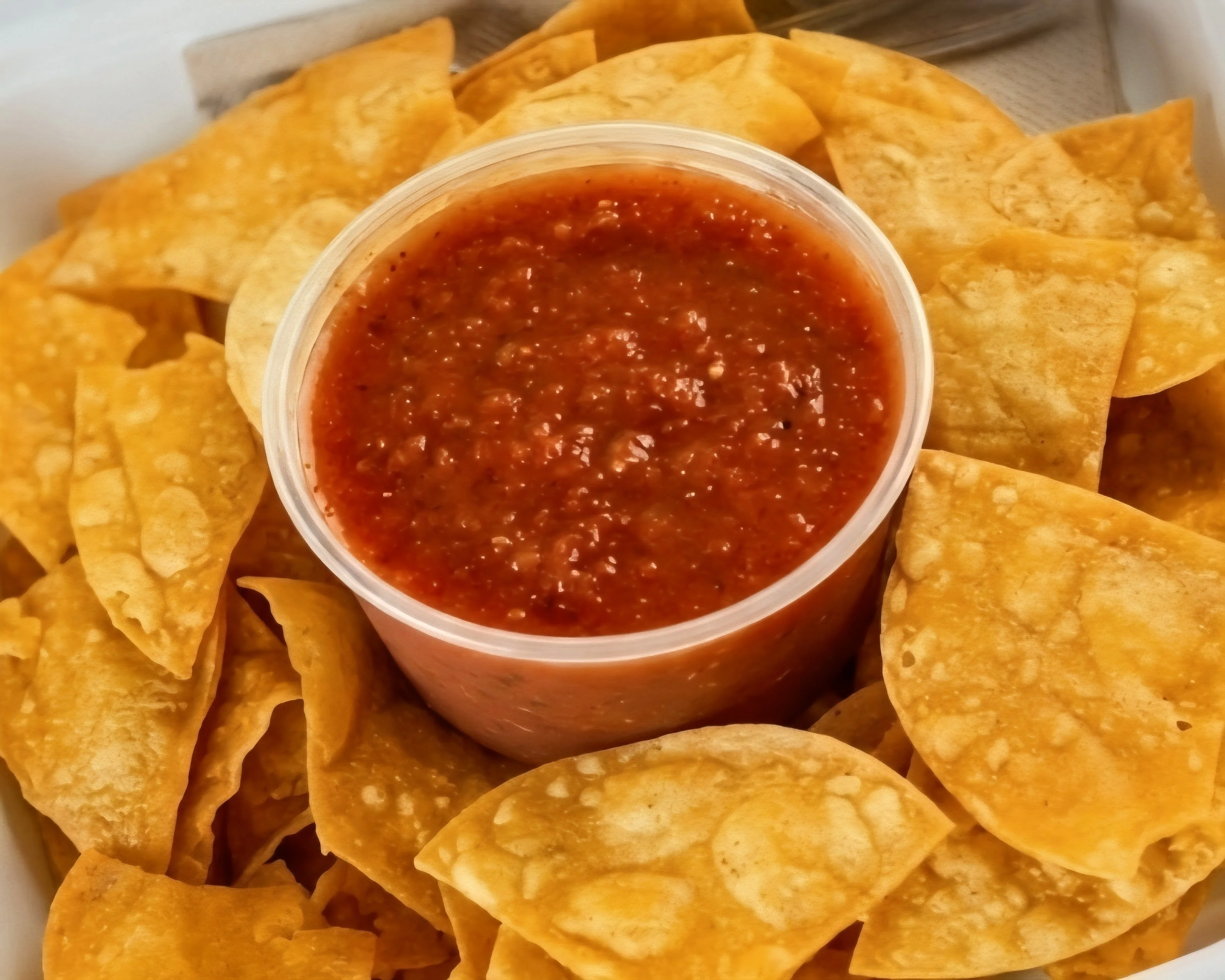 Crispy tortilla chips with salsa