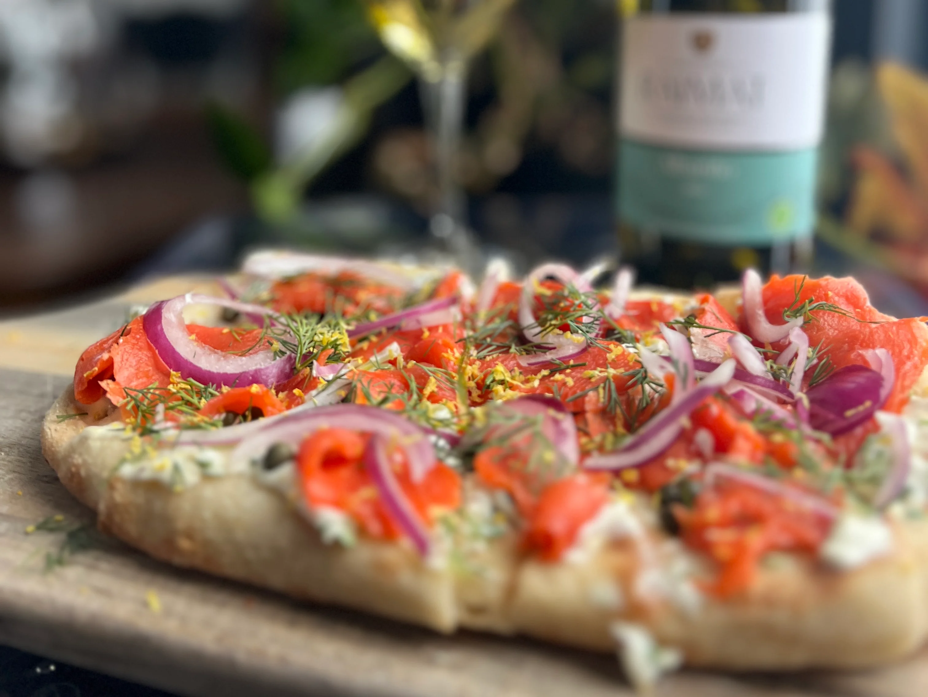 Smoked salmon flatbread with fresh herbs and onions
