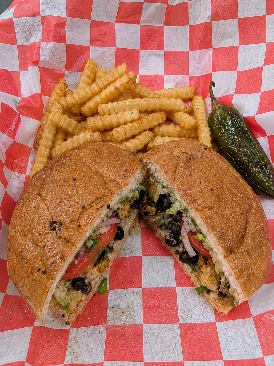 Delicious Mexican torta with fries and salsa verde