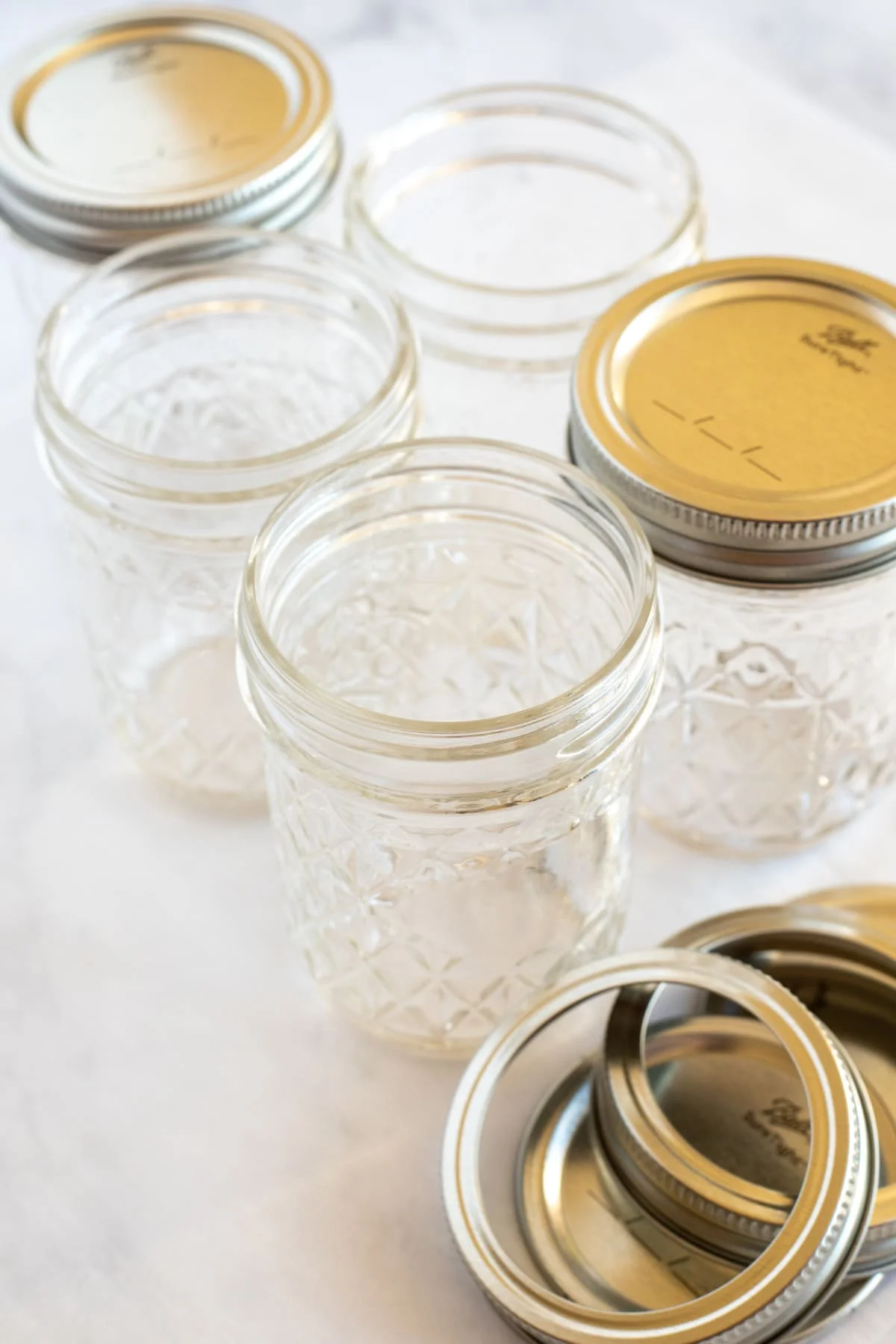Collection of glass mason jars with metal lids