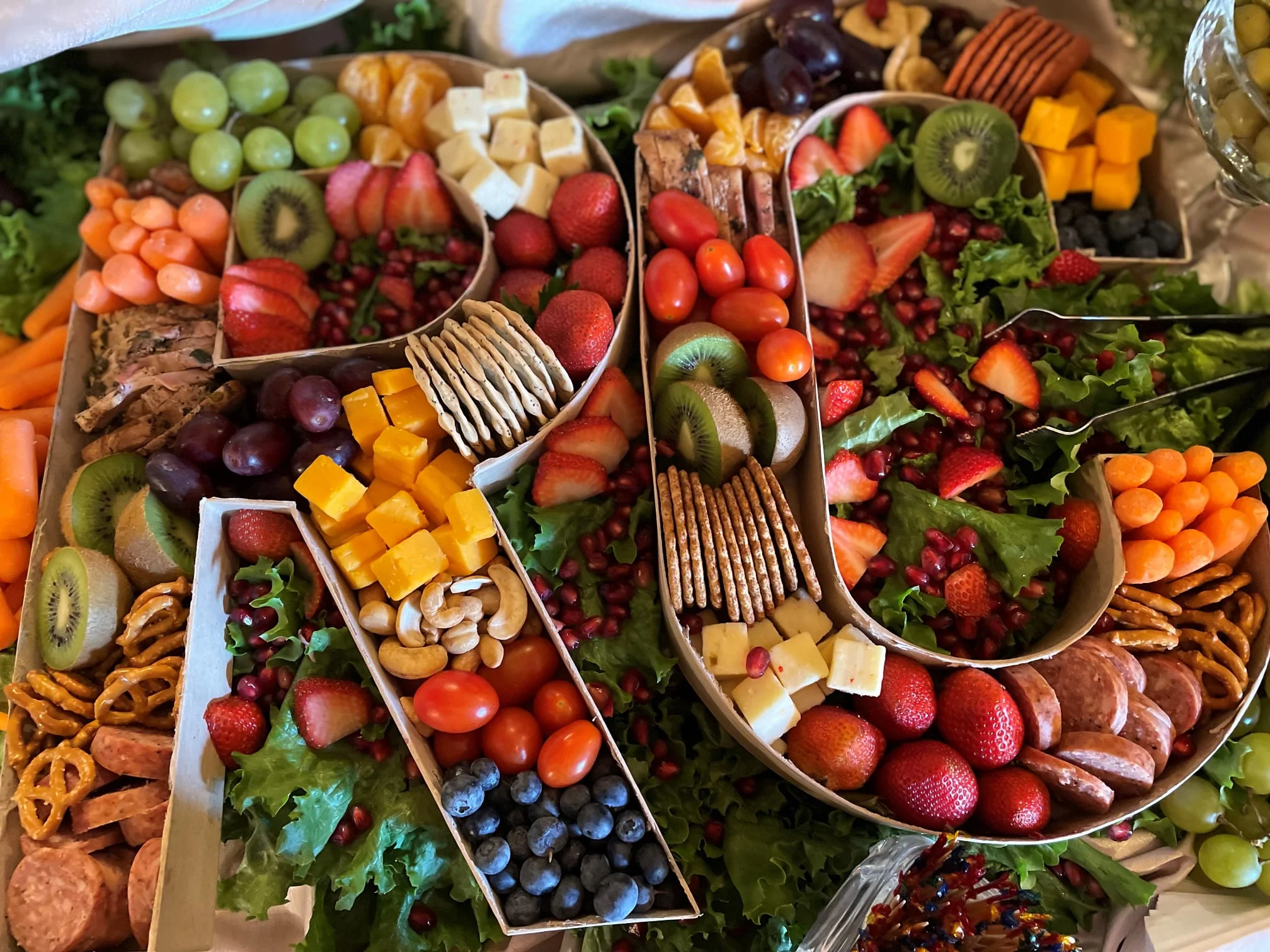 Colorful charcuterie board with fruits and cheeses