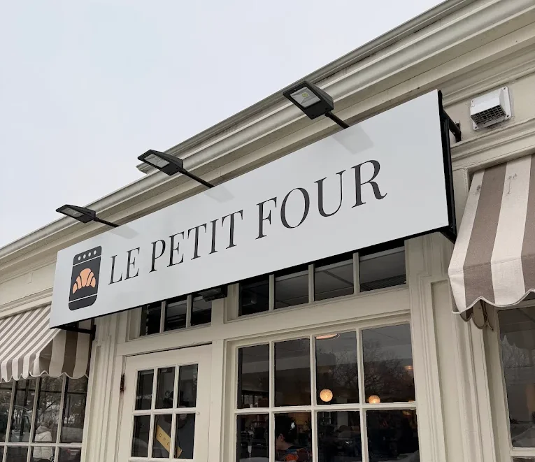 Exterior view of Le Petit Four restaurant showcasing its charming facade.