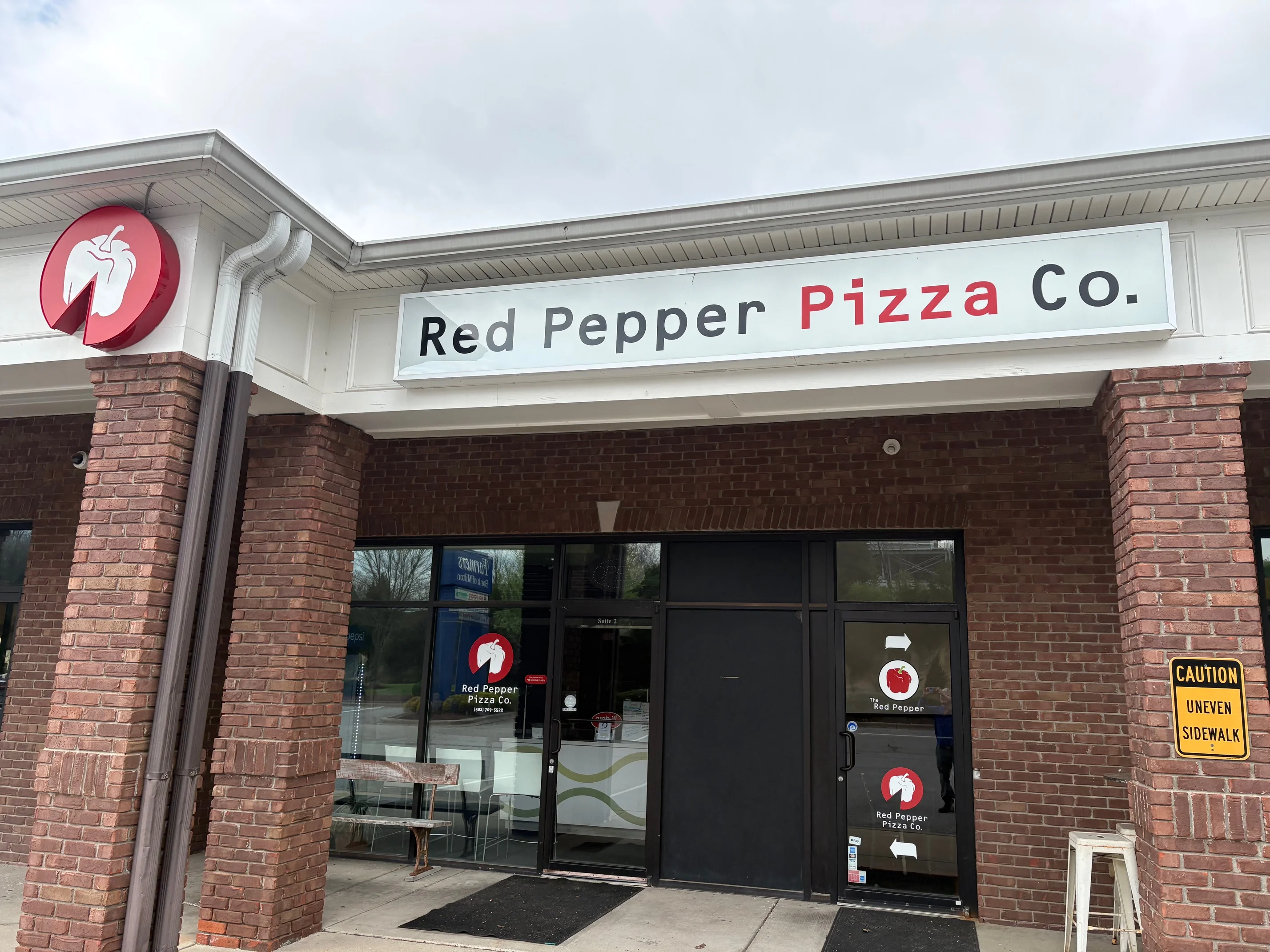 The storefront of Red Pepper Pizza Co.