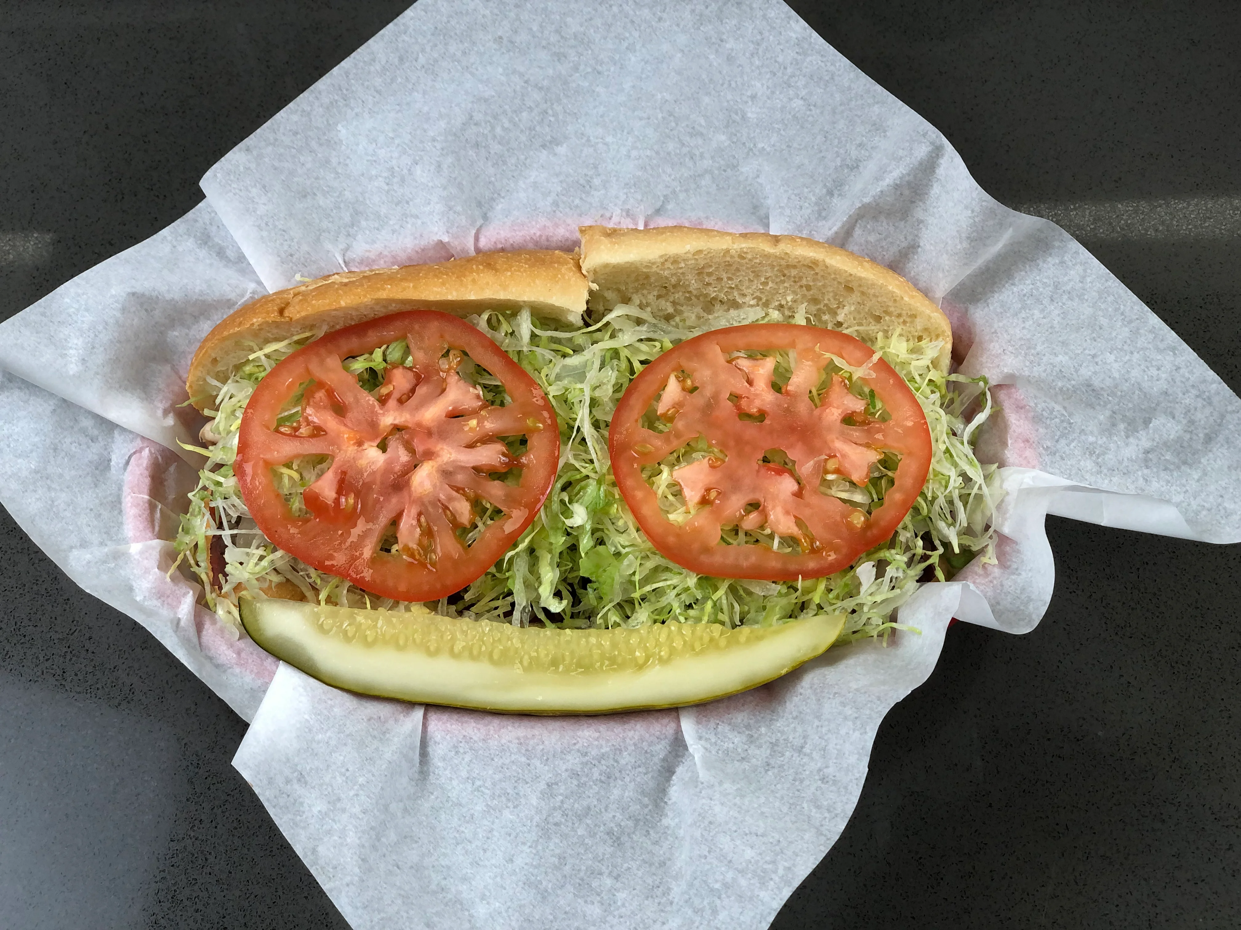 Classic American sub sandwich with lettuce and tomato