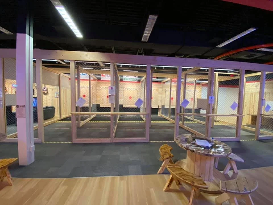 Modern dining area with wooden enclosures and seating