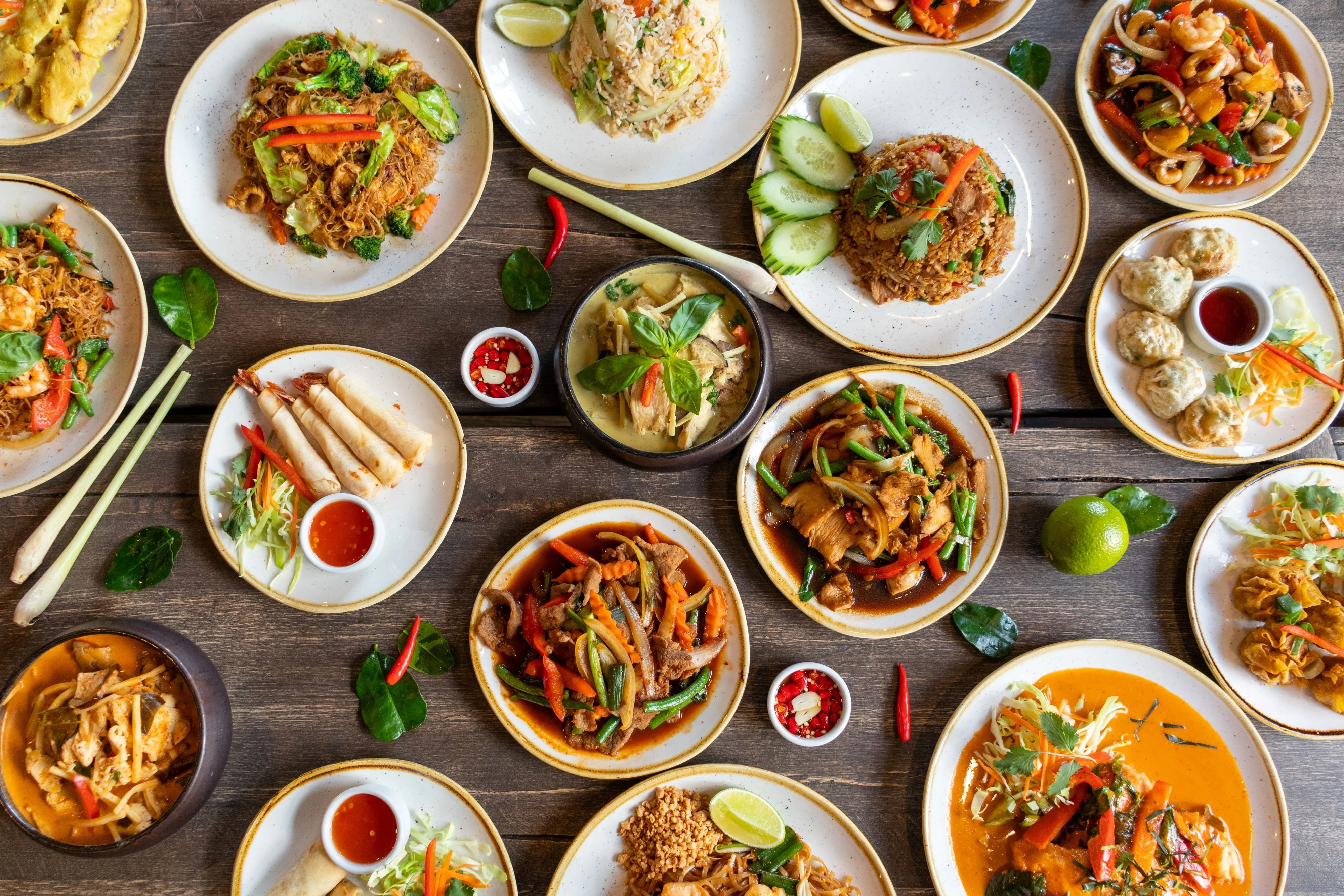 Assorted Thai dishes including pad thai and green curry