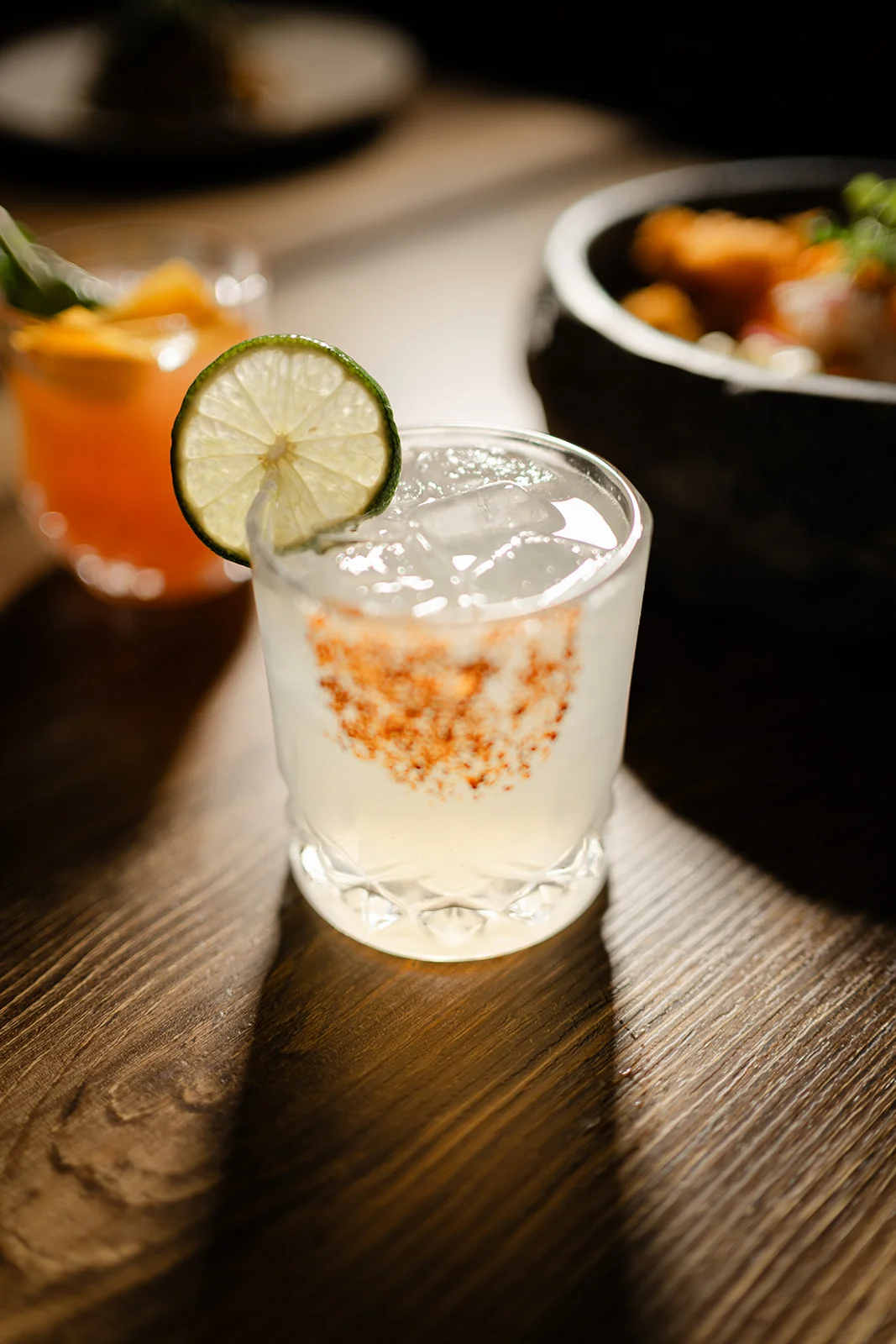Refreshing Mexican cocktail with lime and chili rim