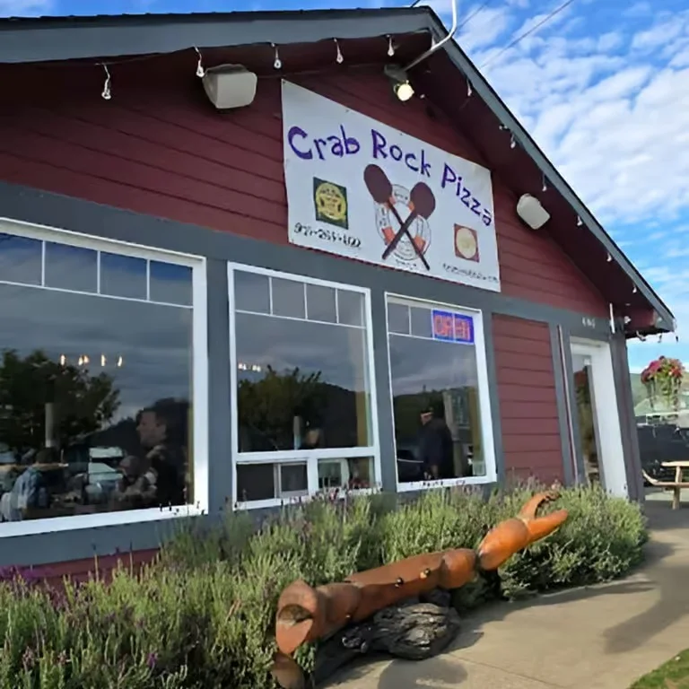 Exterior of Crab Rock Pizza restaurant with open sign