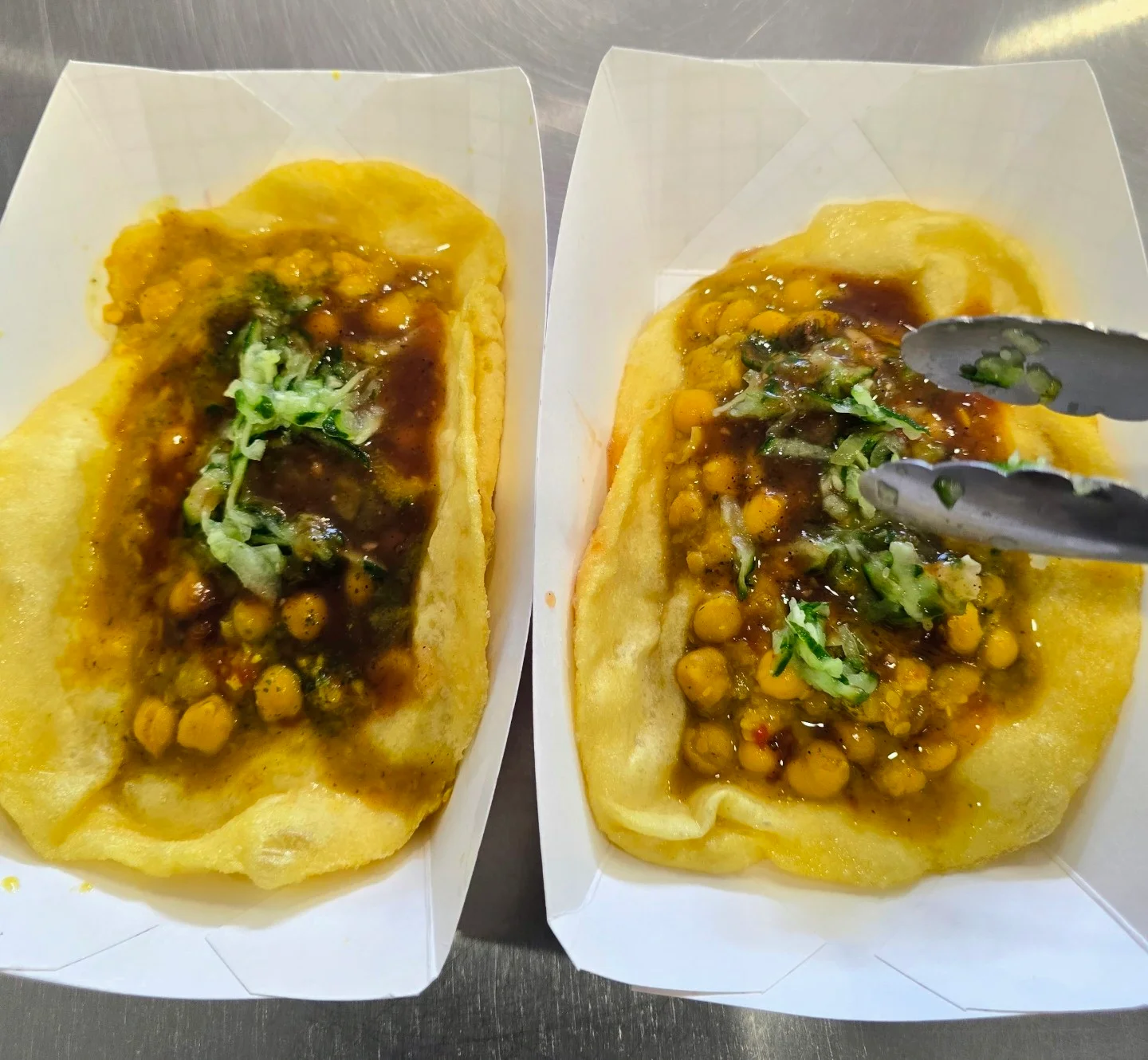 Chaat papdi topped with chickpeas and tangy sauces