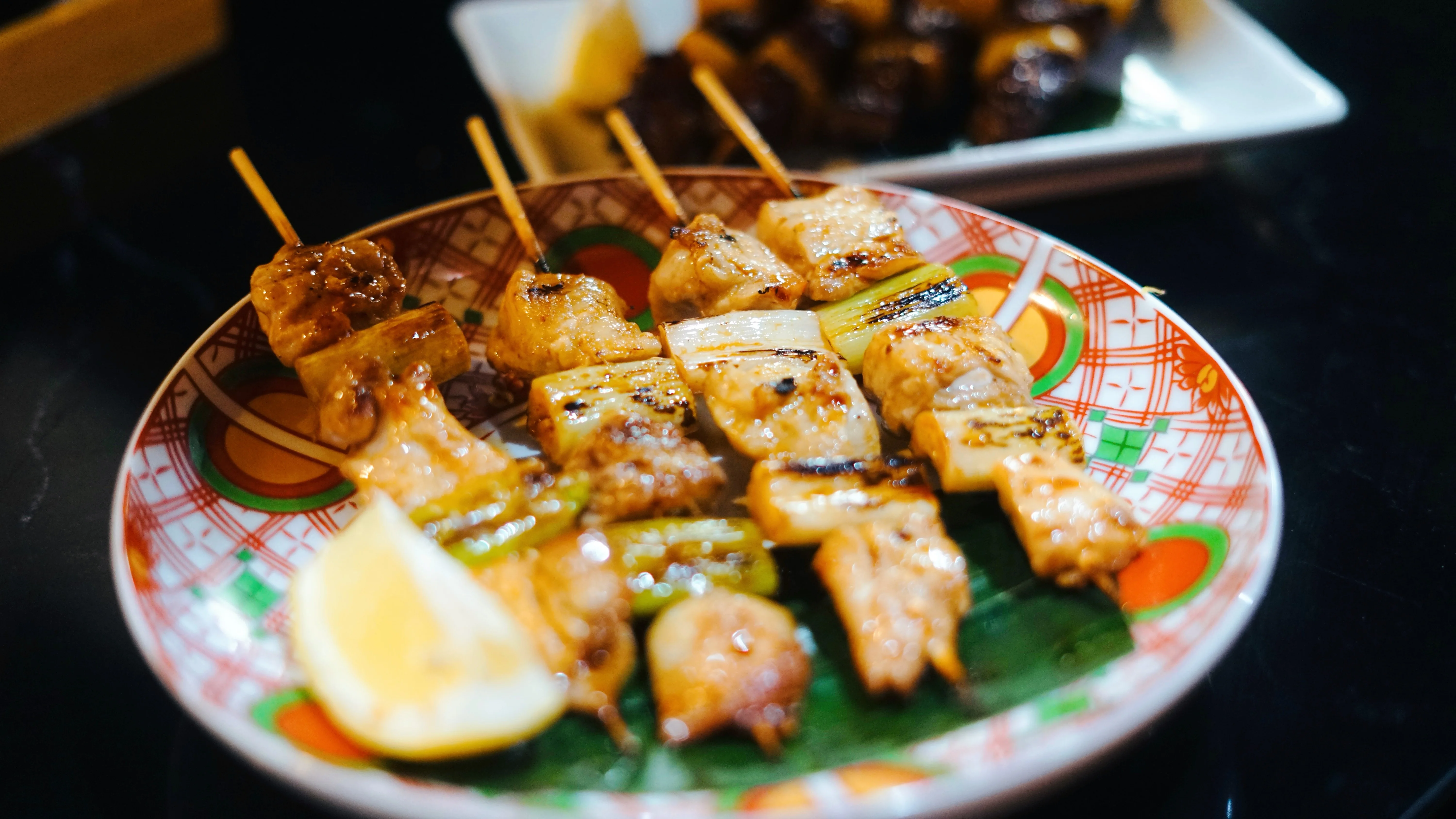 A beautifully arranged table with various dishes and drinks in a restaurant setting.