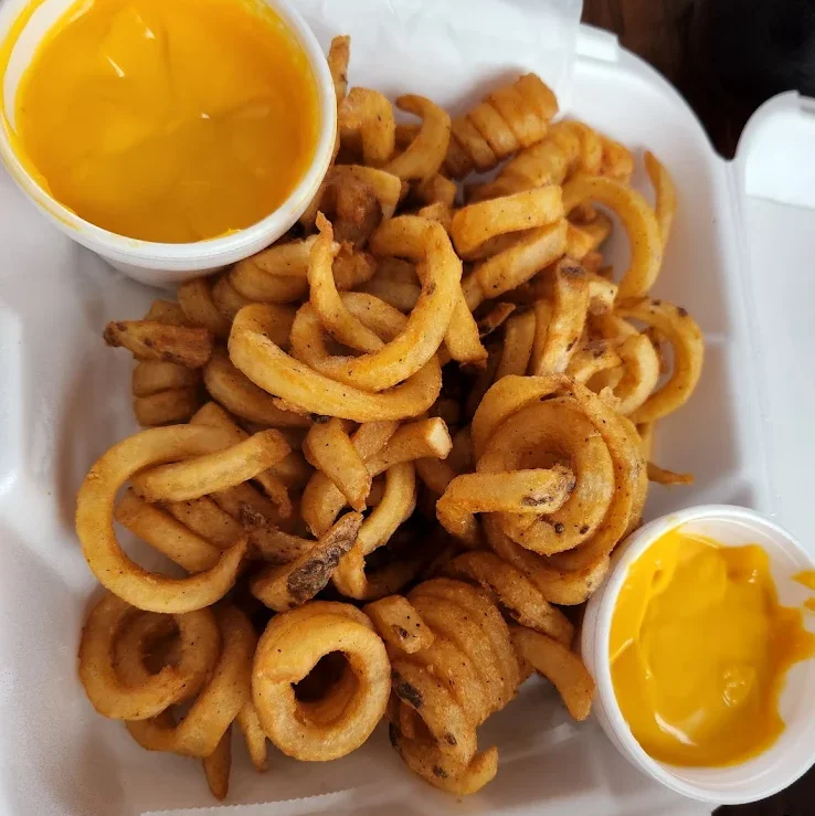Crispy curly fries with cheese dip