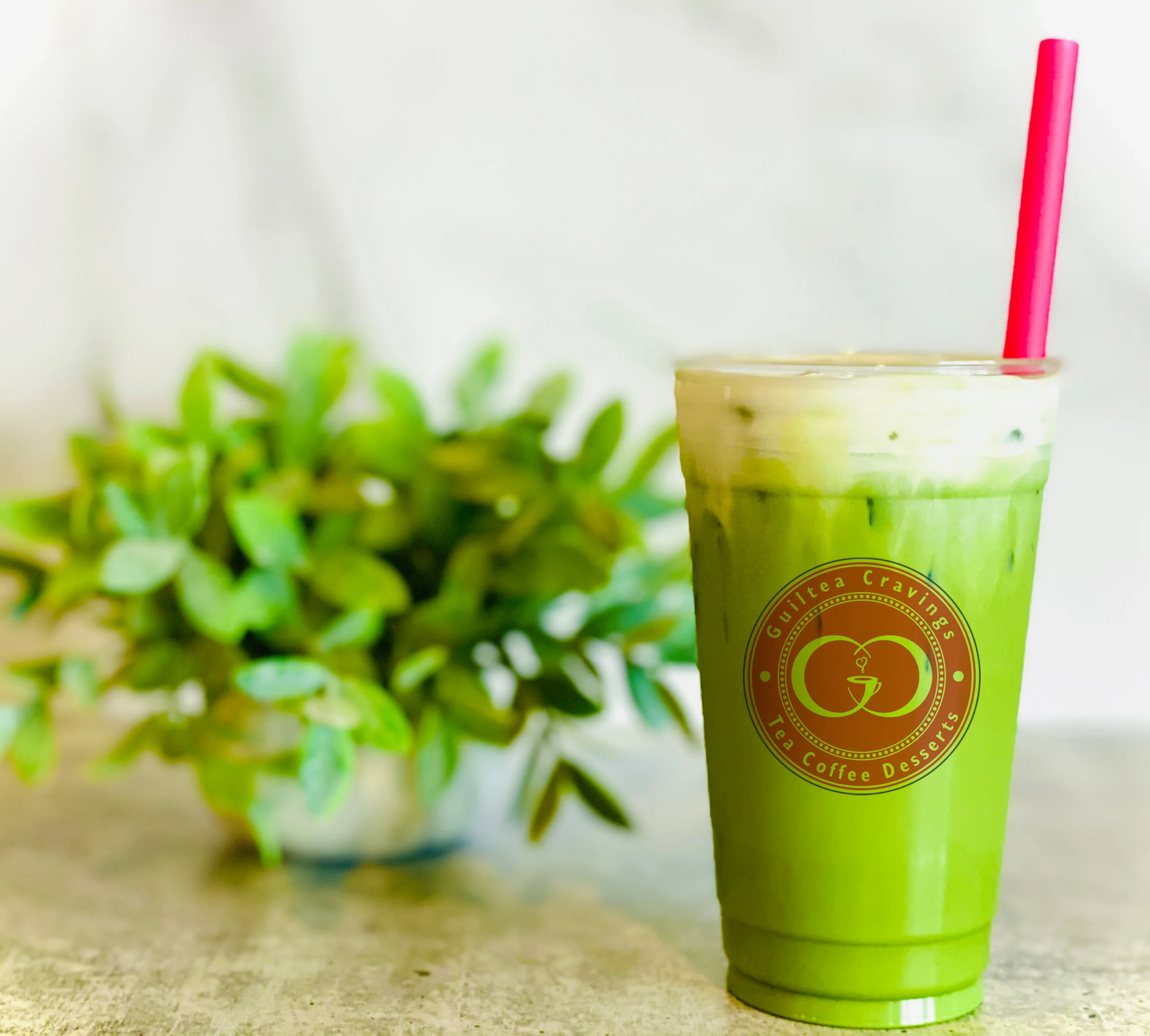 Iced matcha latte with creamy foam