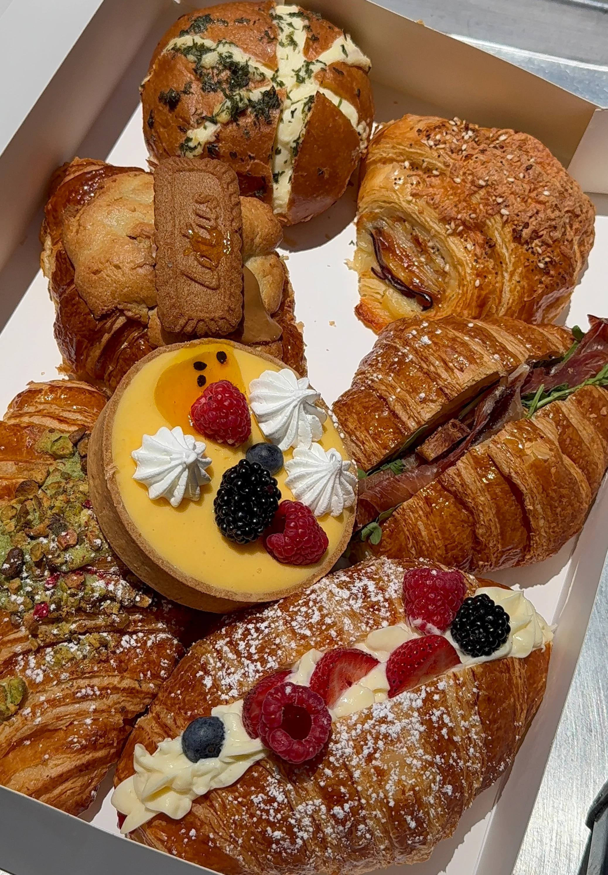 A selection of pastries and drinks from a restaurant's breakfast menu.