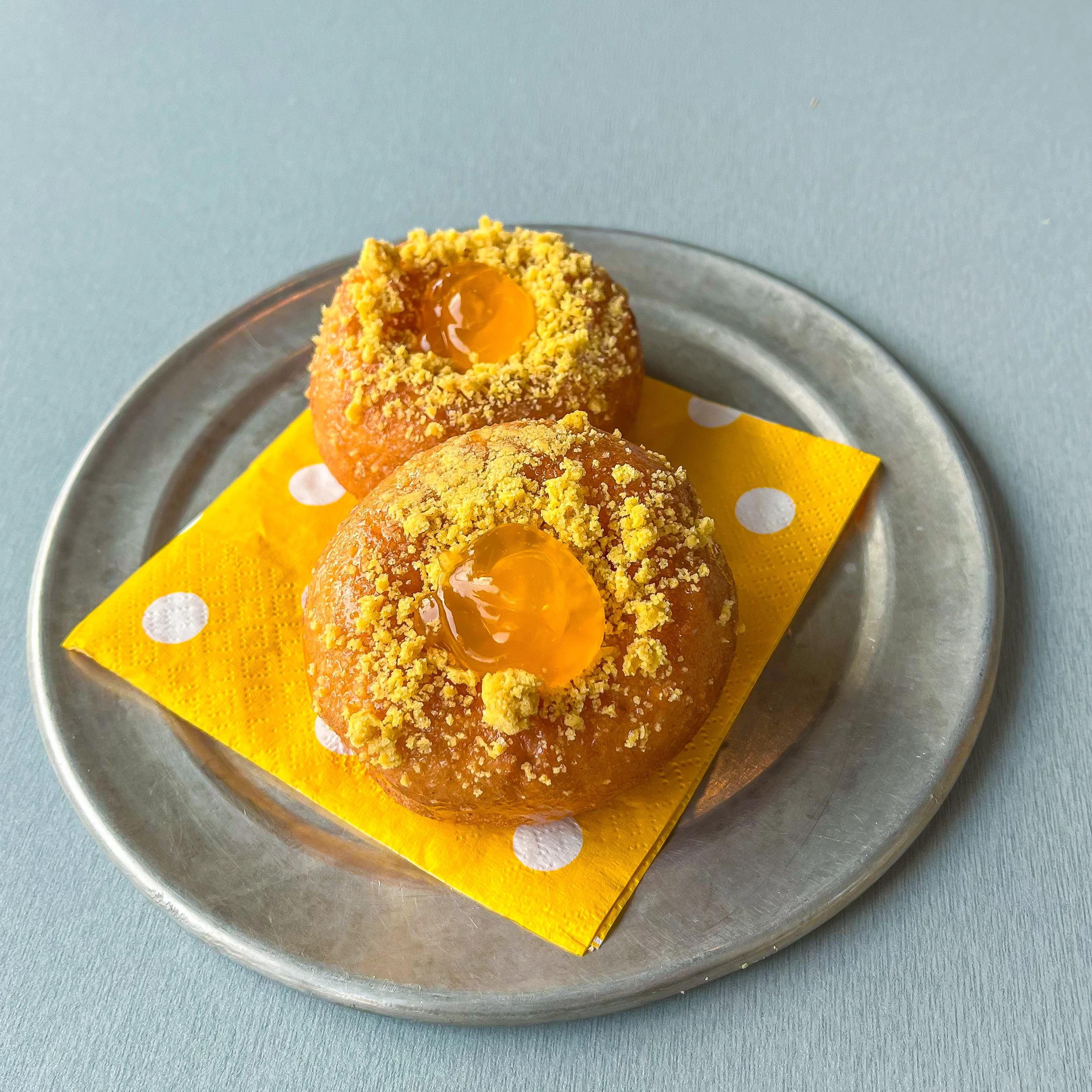 Delicious Indian-style sweet doughnuts with egg yolk topping