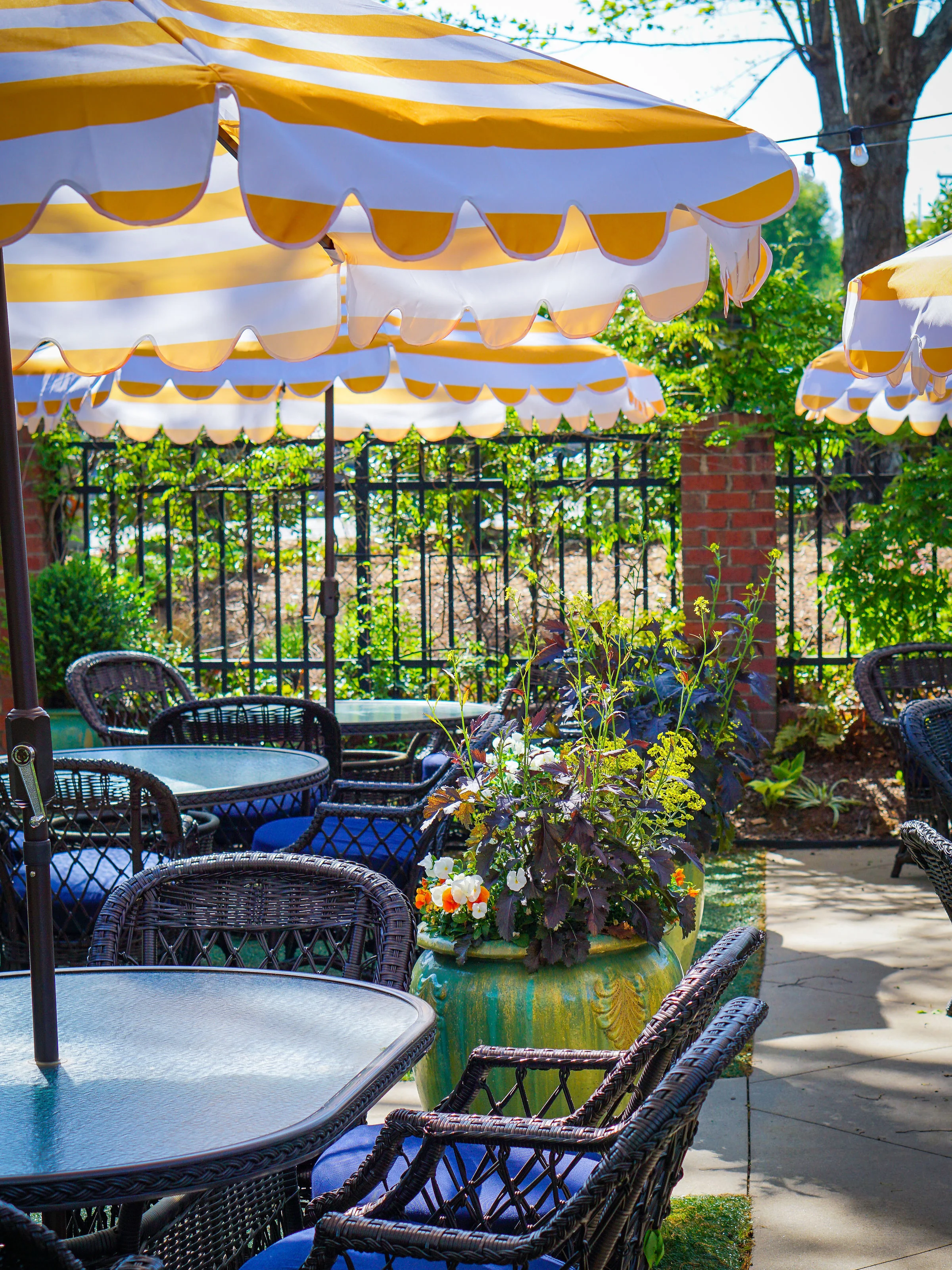 Charming outdoor dining area with striped umbrellas