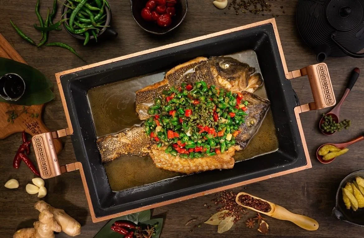 Sichuan-style steamed fish with spicy green sauce