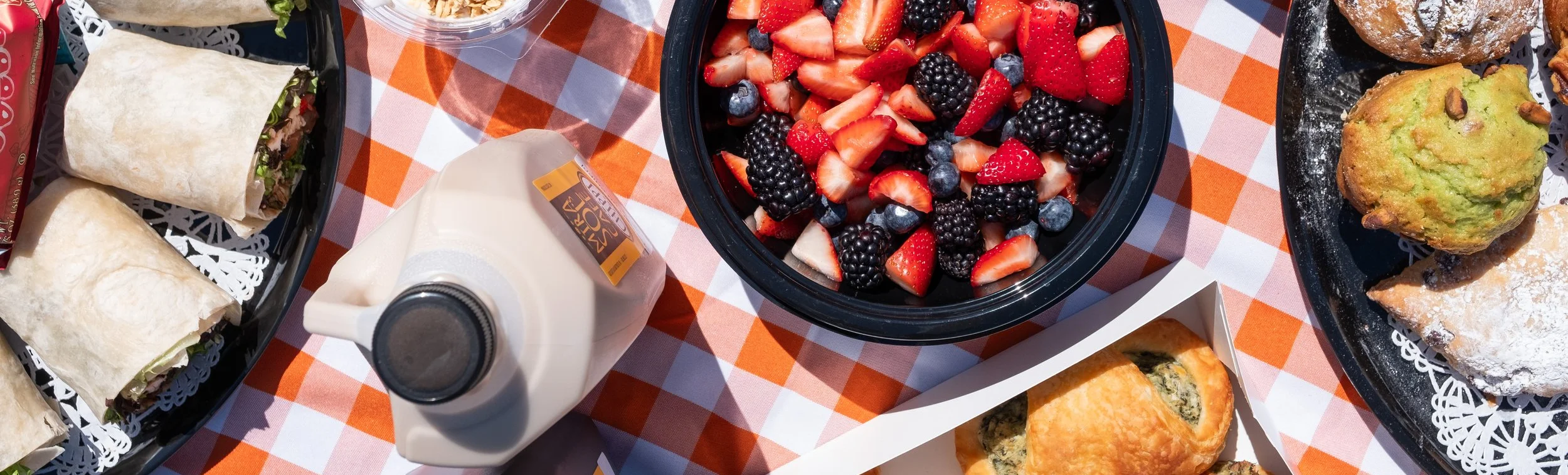 Colorful fruit salad with berries and strawberries in a bowl