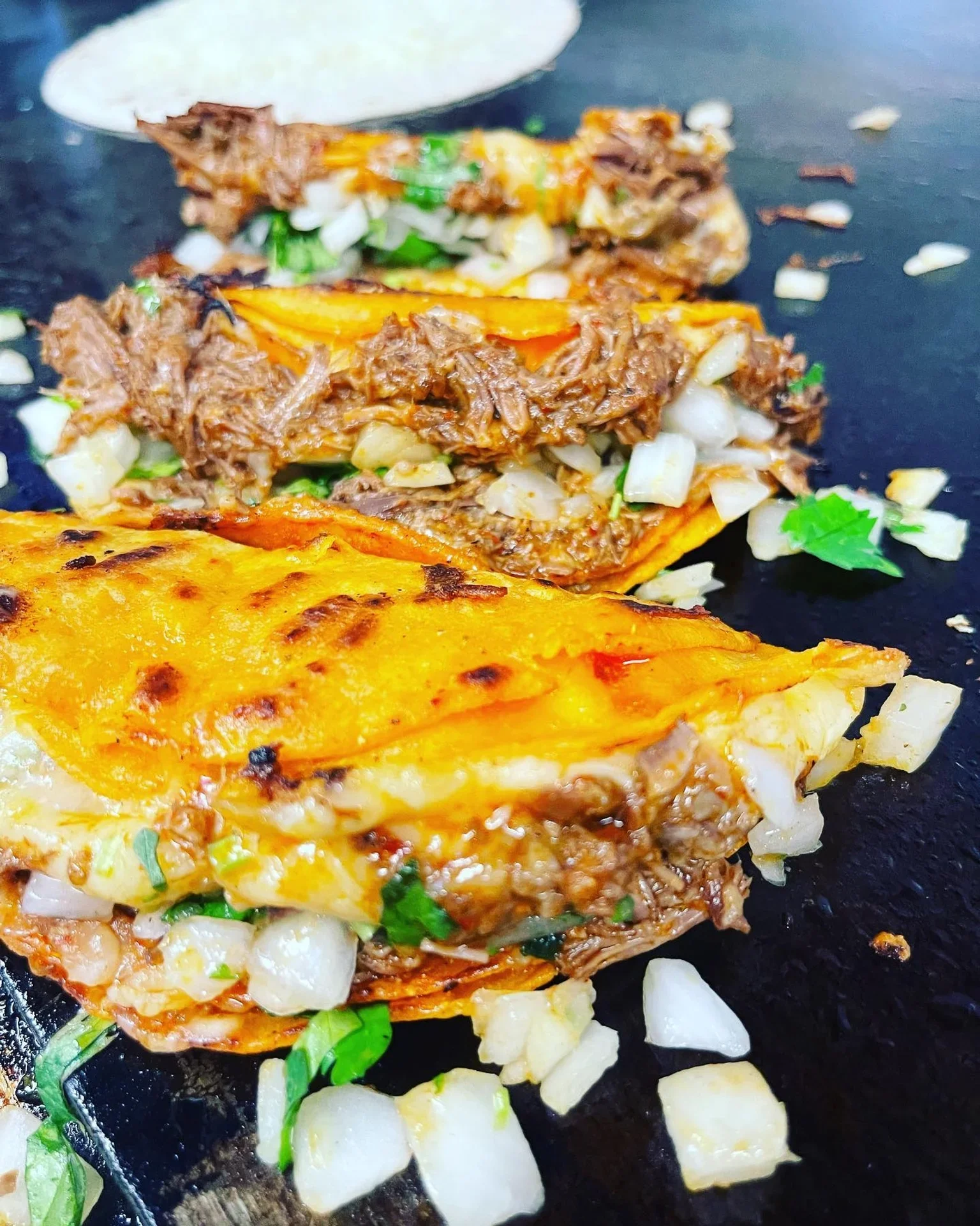 Delicious Mexican birria tacos with fresh toppings