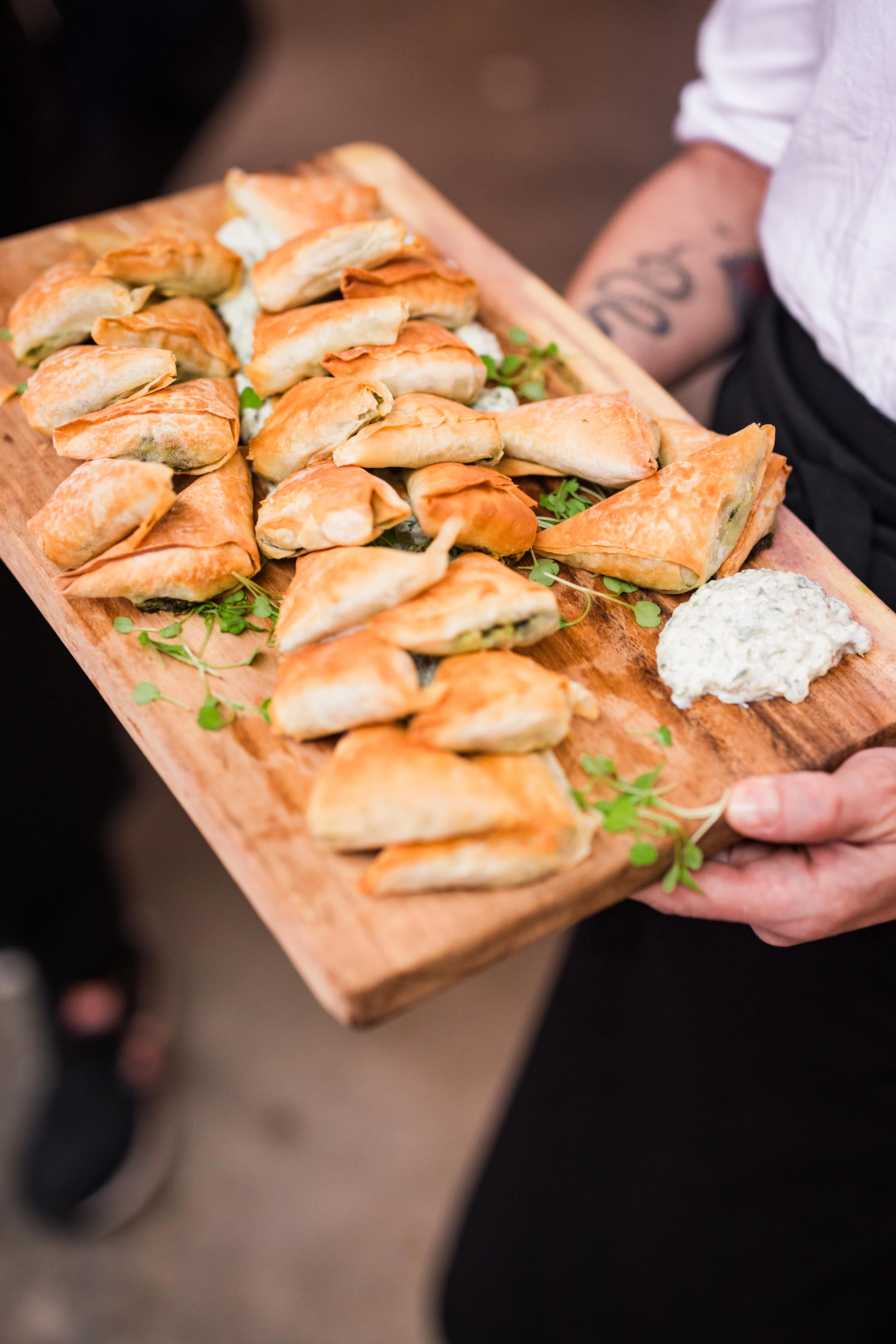 Savory Greek spanakopita on a wooden platter